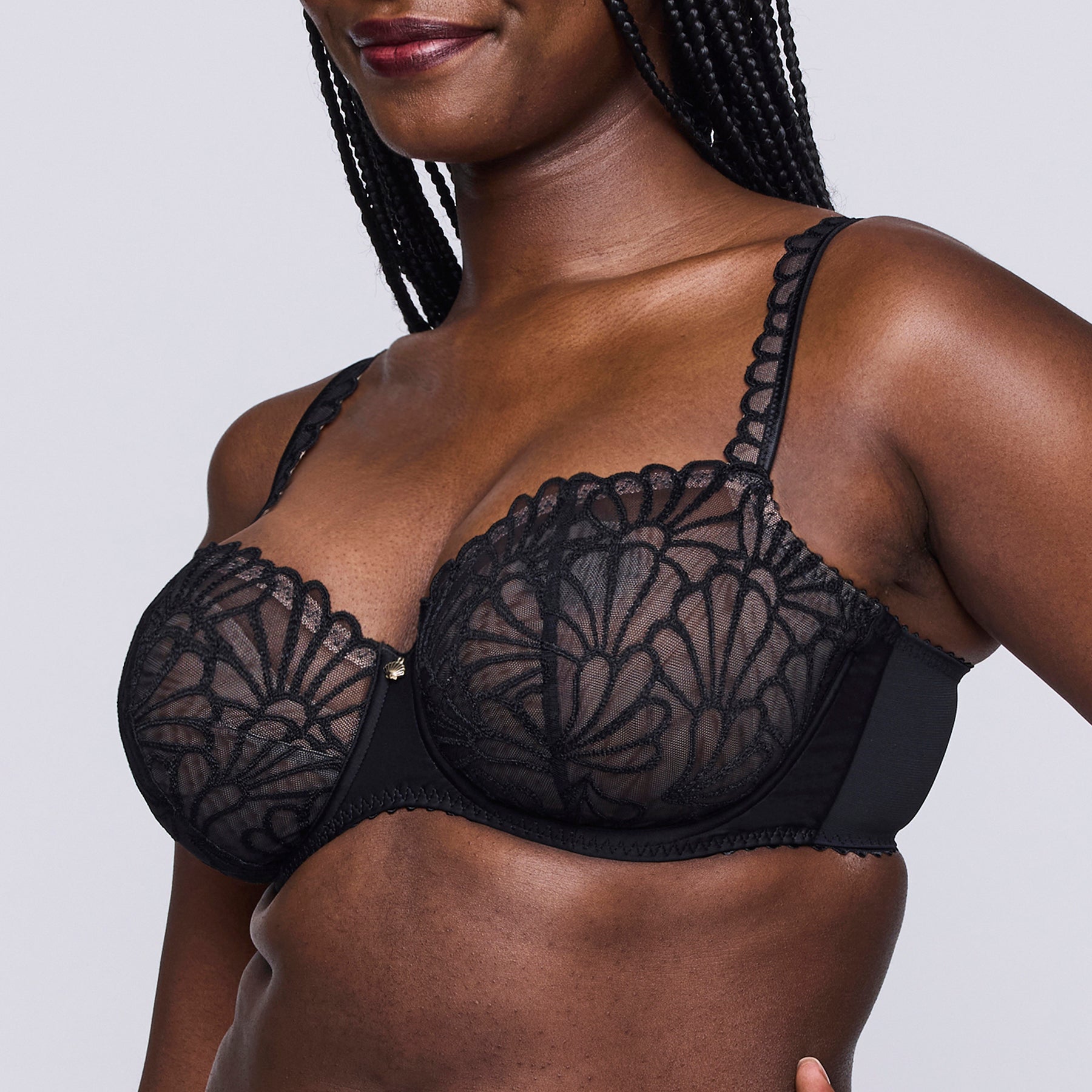 Side view of PrimaDonna Gallipoli Balcony Bra in black, highlighting three-part cups, fan-inspired lace, and supportive underwire.