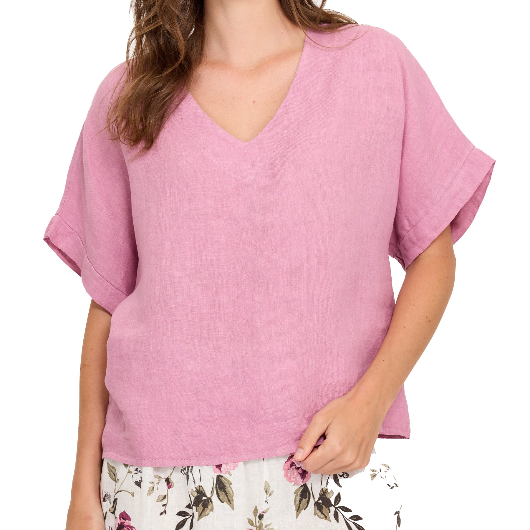Close-up of peony pink linen blouse with V-neckline and rolled short sleeves