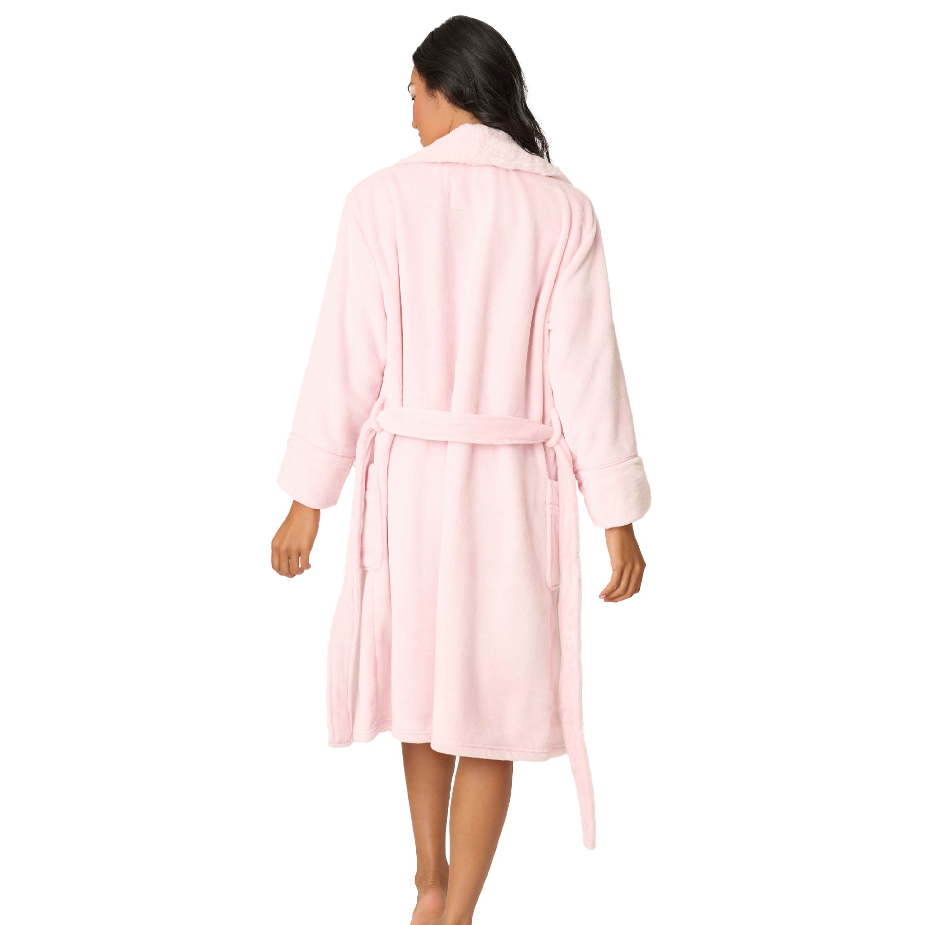 Woman wearing a pink robe on a white background