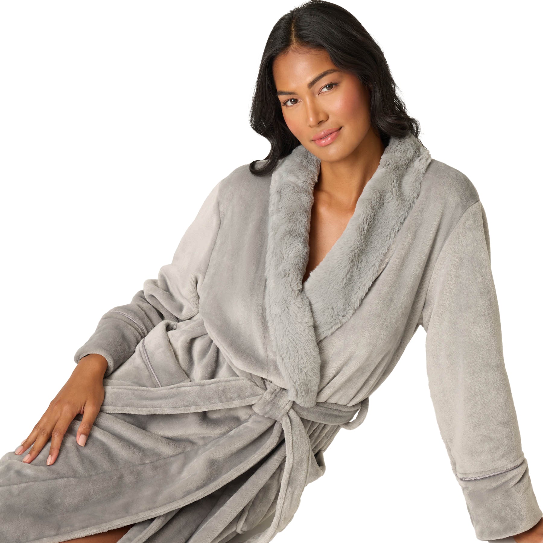 Woman wearing a gray robe with a white background