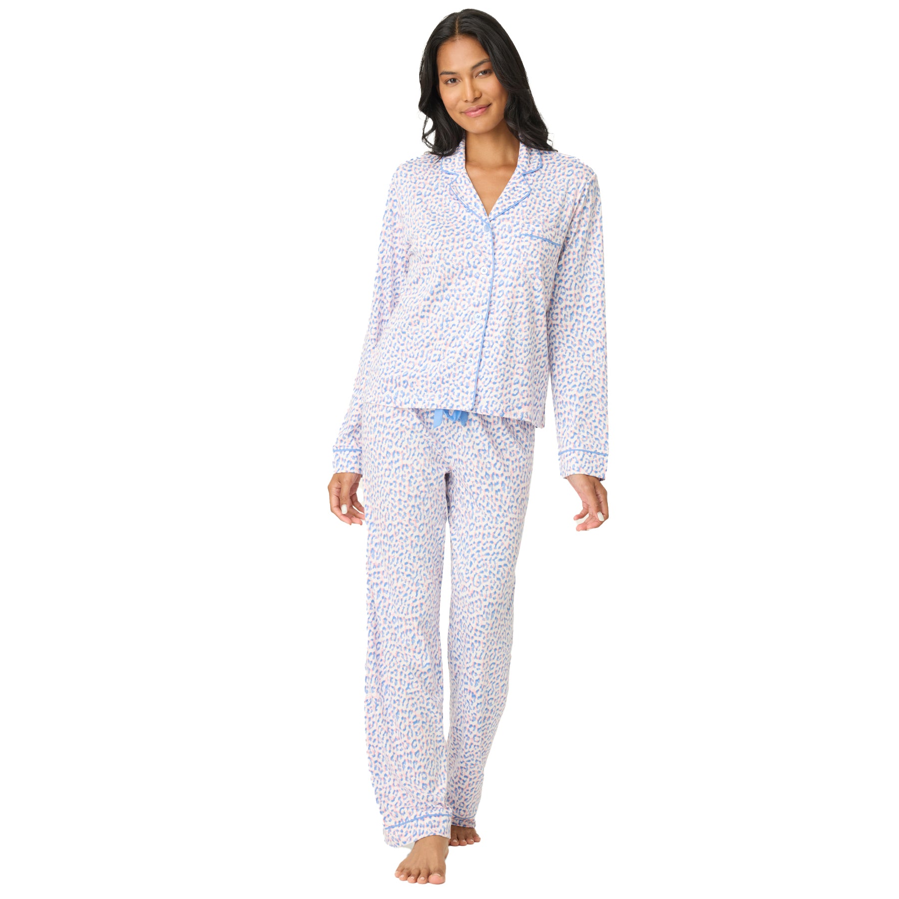 Model wearing a bluebird leopard print long-sleeve pyjama set with button-up top and full-length pants on a white background