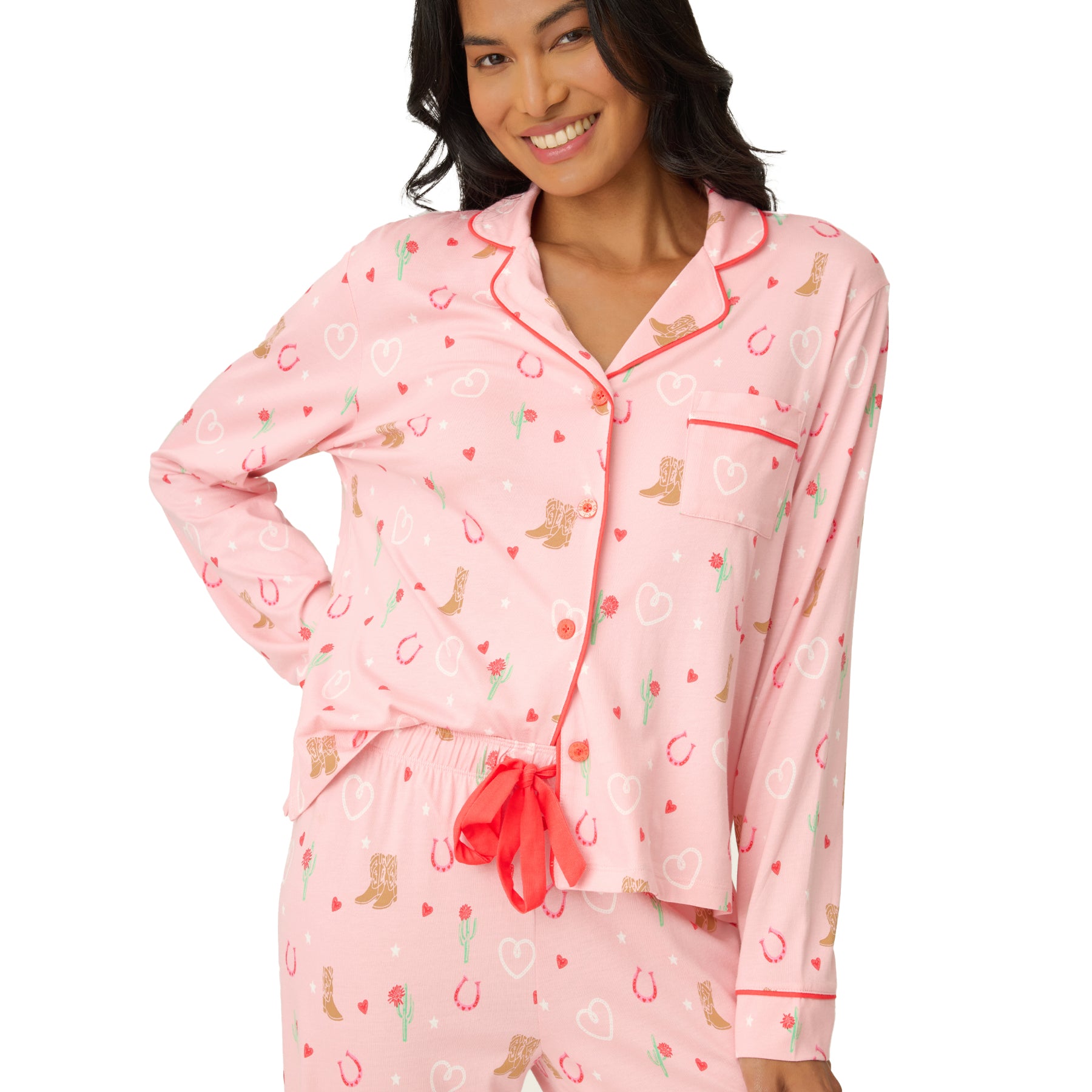 Front view of the pink long sleeve button-up pyjama set with matching drawstring pants and red piping details.