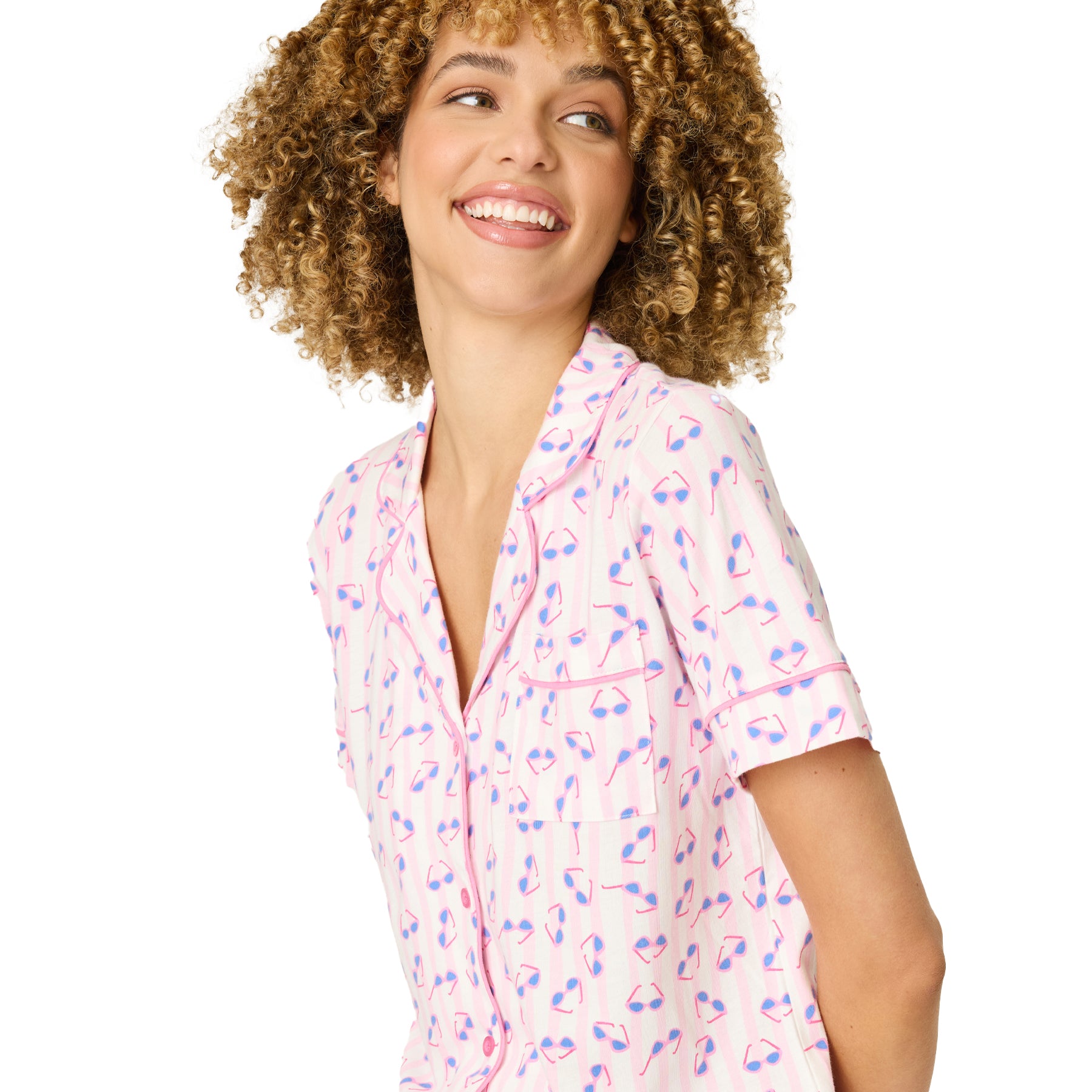 Close-up of light pink pyjama top with sunglasses print and soft fabric detail