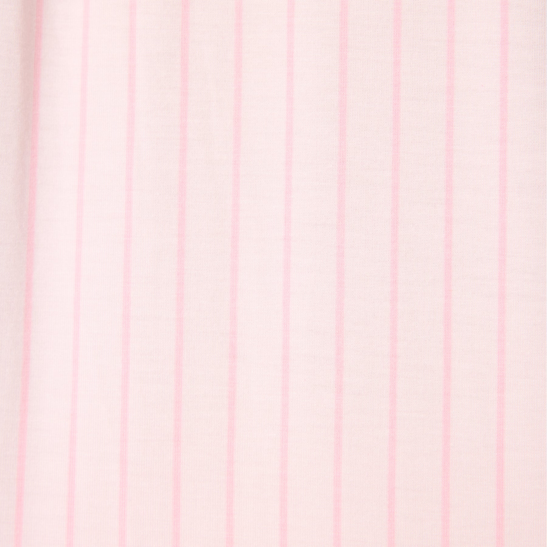 Close-up of soft ballet pink fabric with fine vertical stripe pattern on women’s sleepwear