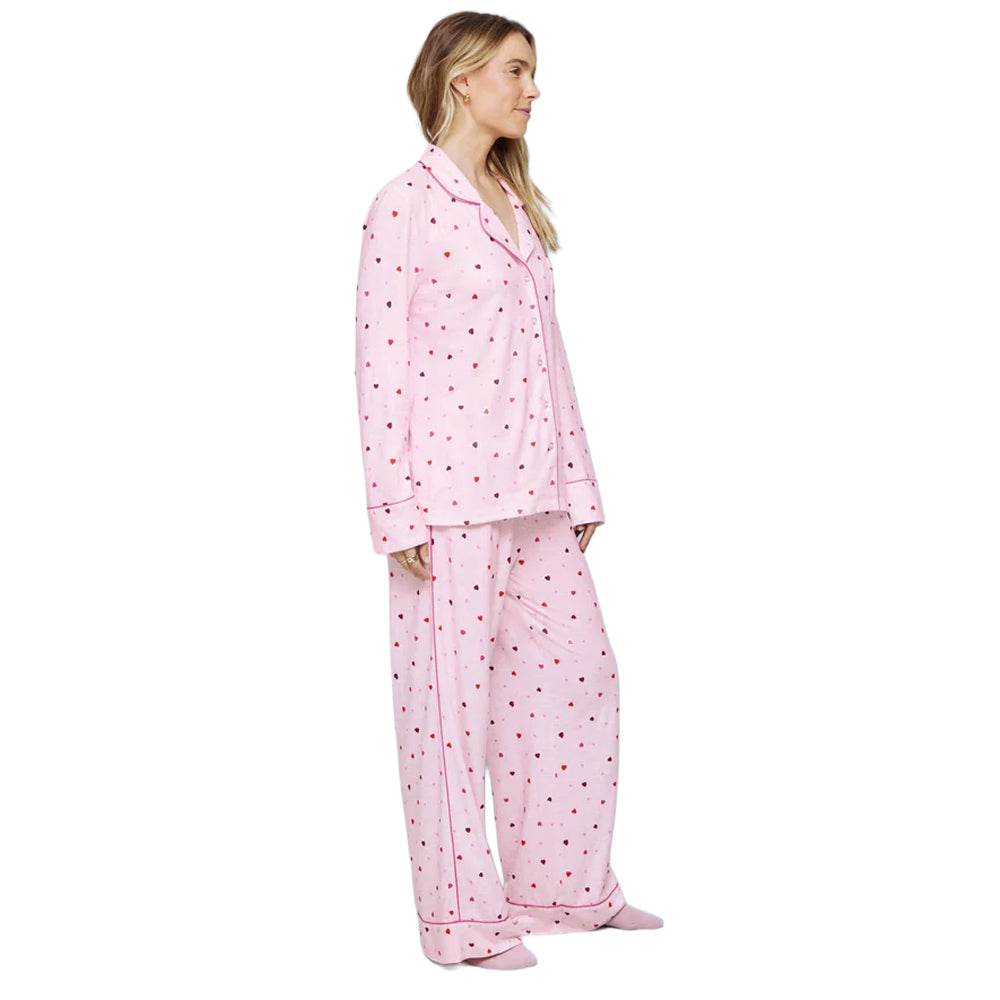 Side view of Splendid Pillowsoft women's pink heart print pajama set with relaxed long-sleeve top and matching full-length pants.
