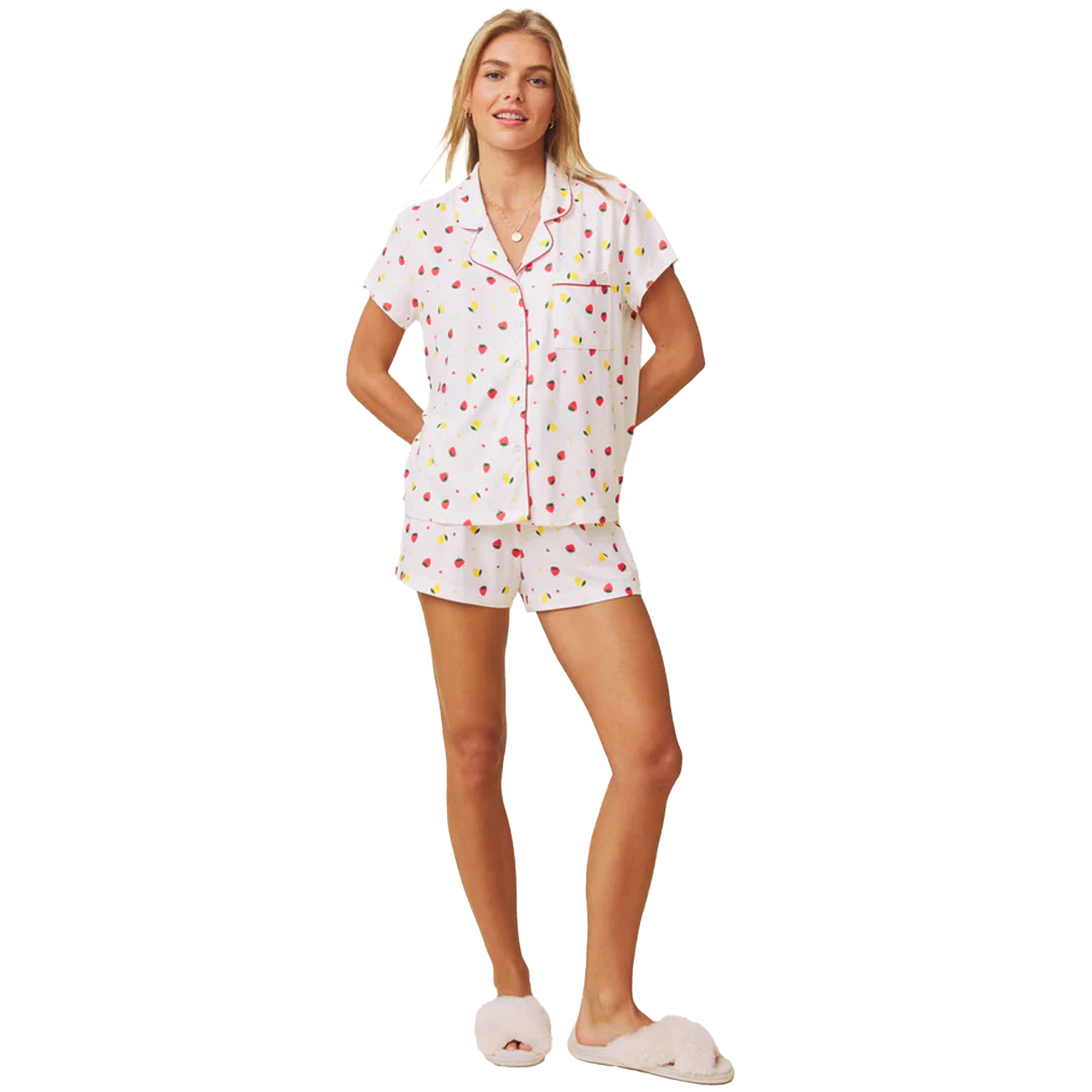Full body view of model in white strawberry and lemon print pyjama set with short sleeves and shorts