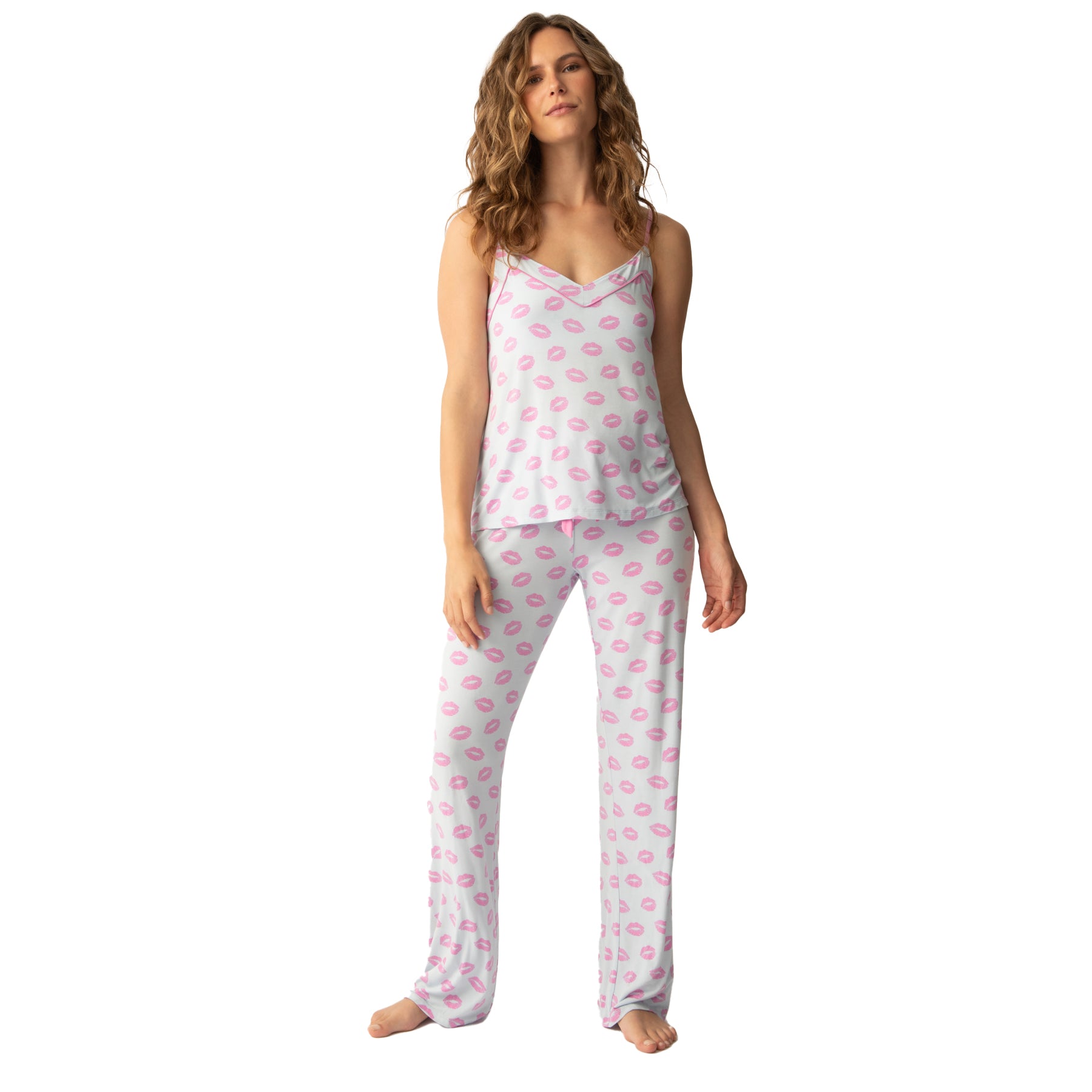 Playful pink lip-print pajama set with a camisole top and relaxed-fit pants, featuring a pink drawstring tie for a cozy and feminine look.