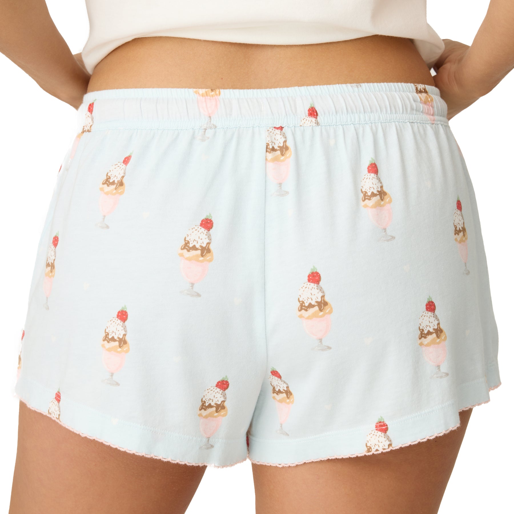 Light blue shorts with ice cream pattern worn by a person