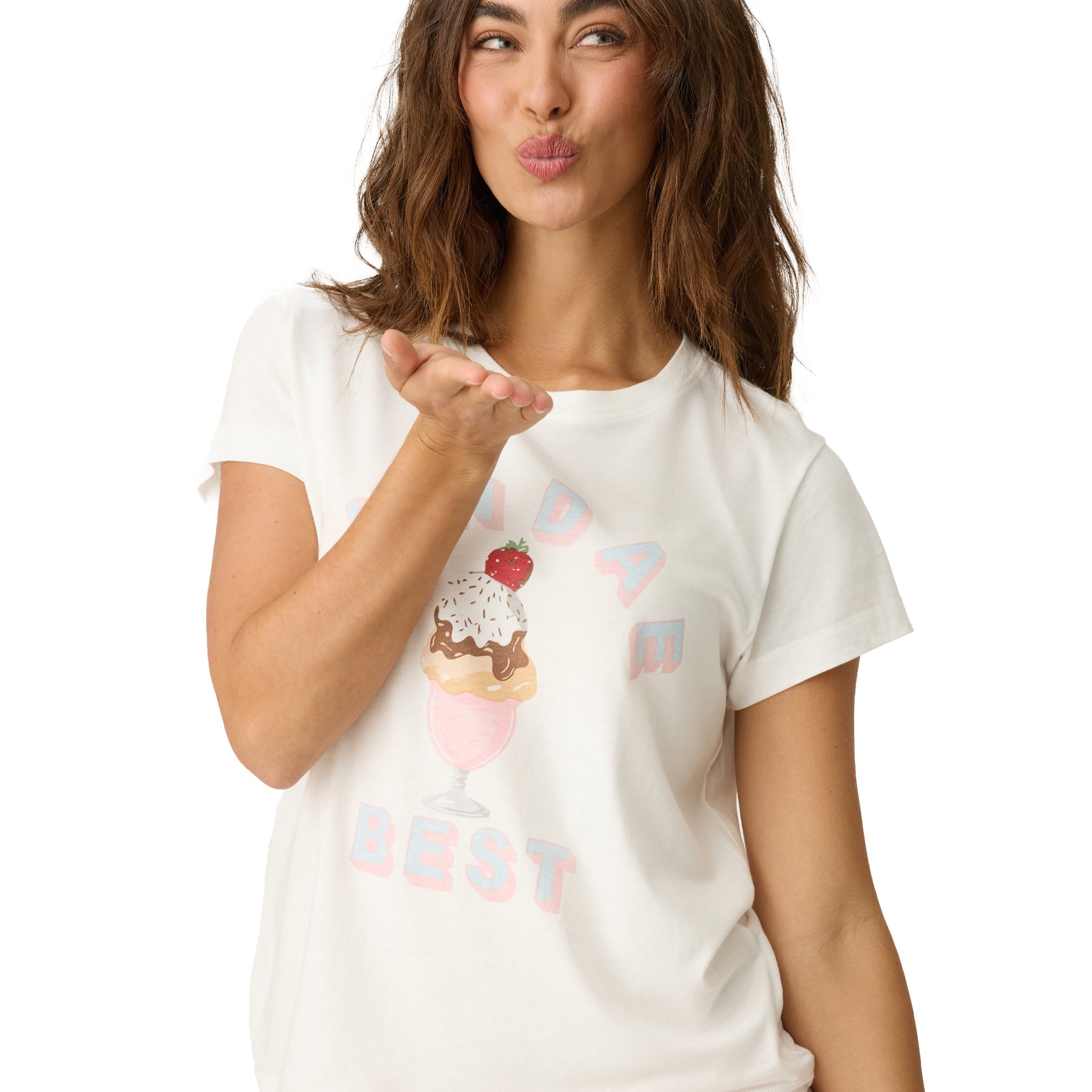 Woman wearing a white t-shirt with graphics and text, blowing a kiss.