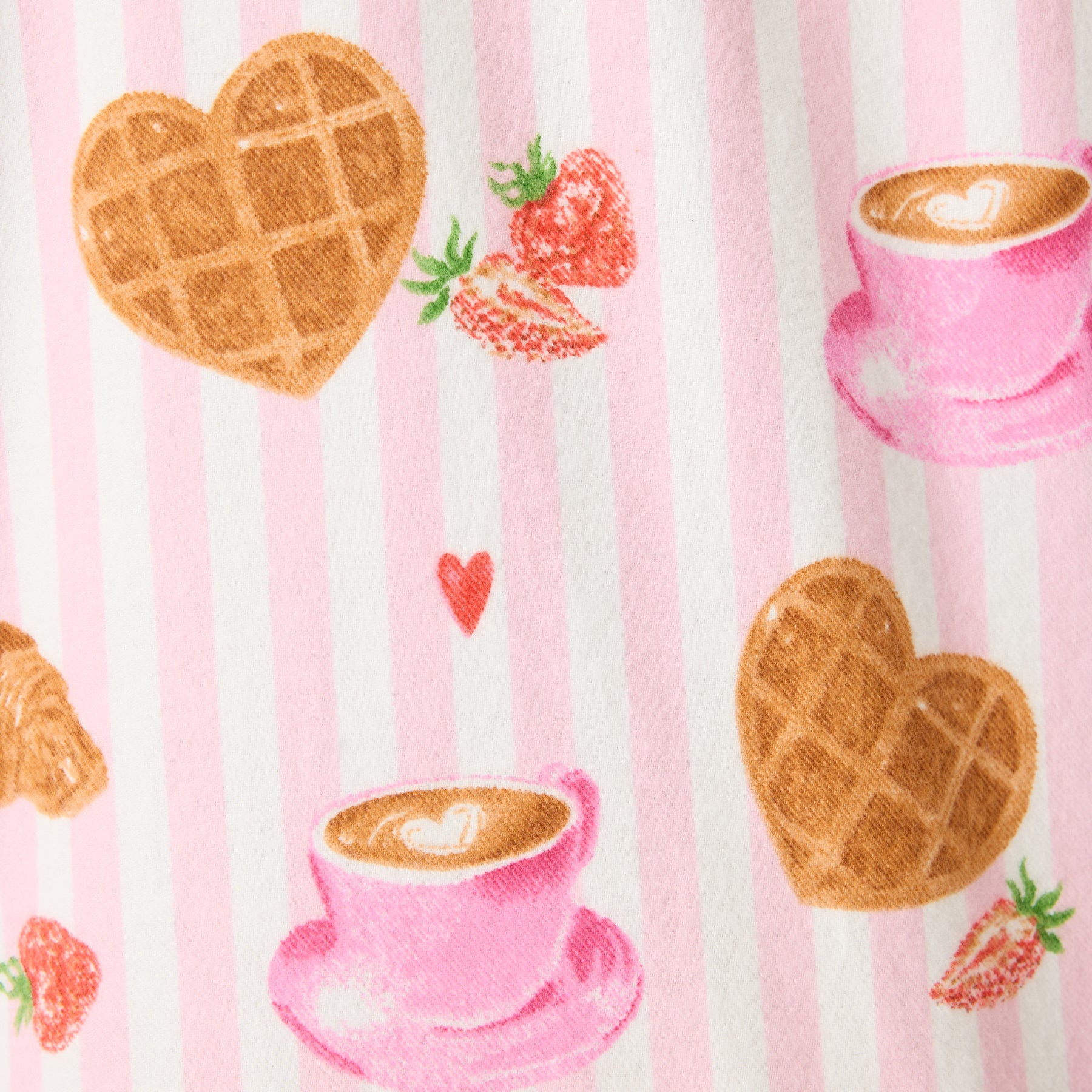 Fabric close-up of pink stripes with waffles, coffee cups, and strawberries
