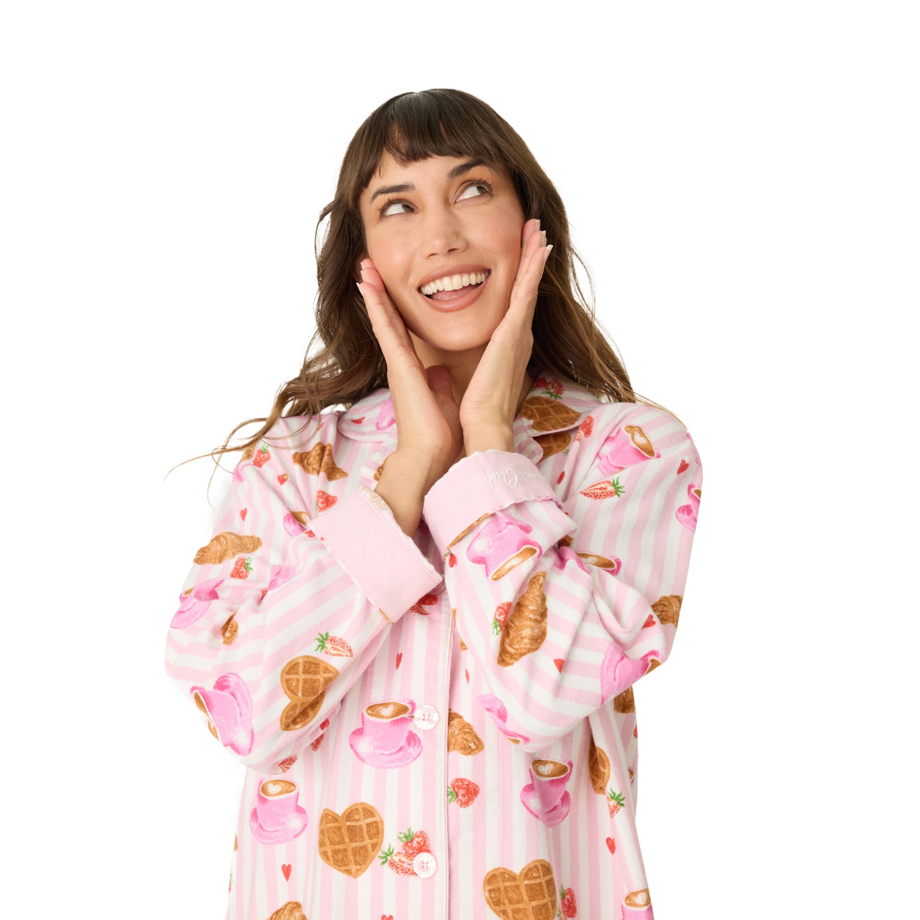 Woman smiling in pink striped breakfast-print nightshirt.