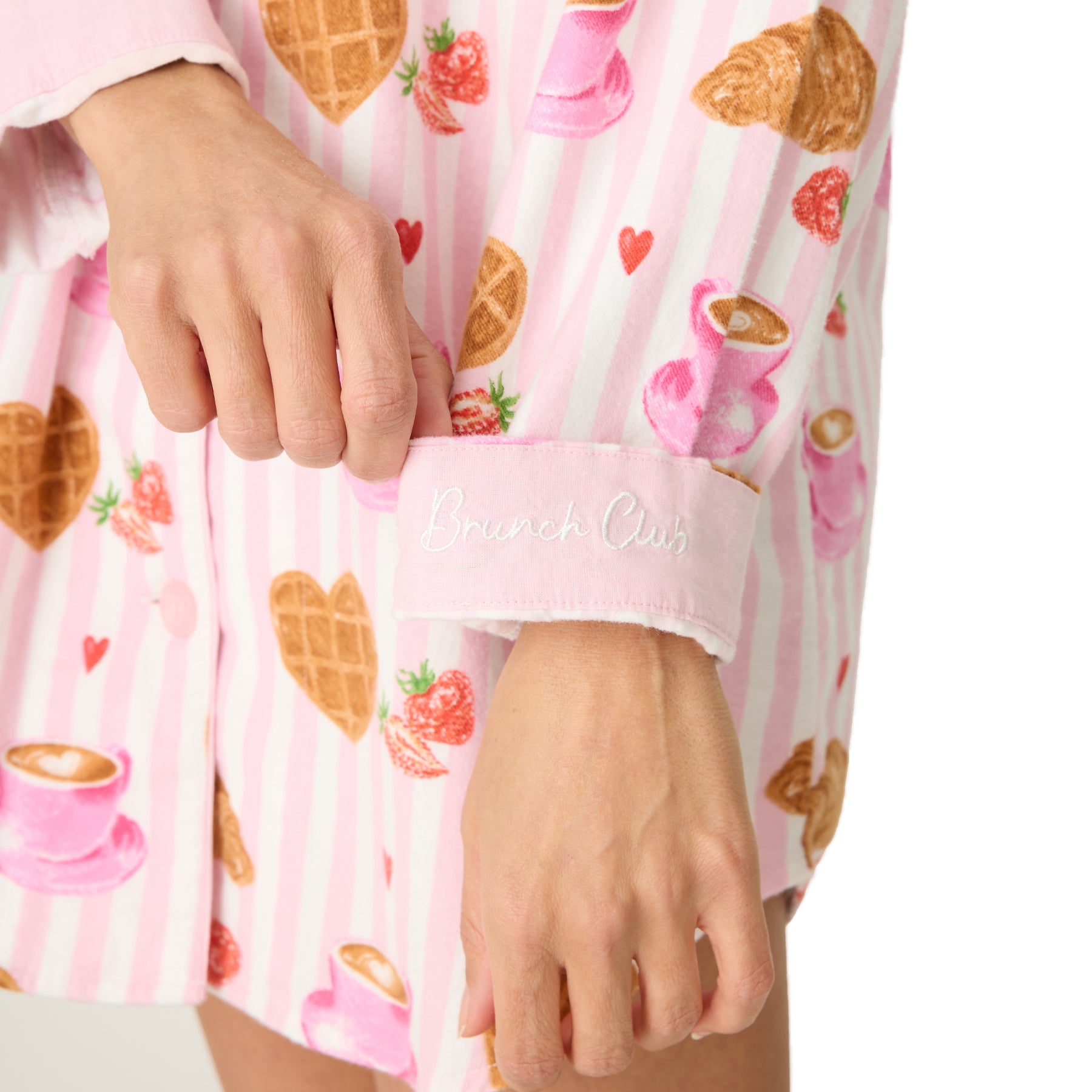 Sleeve detail with “Brunch Club” embroidery on nightshirt cuff.