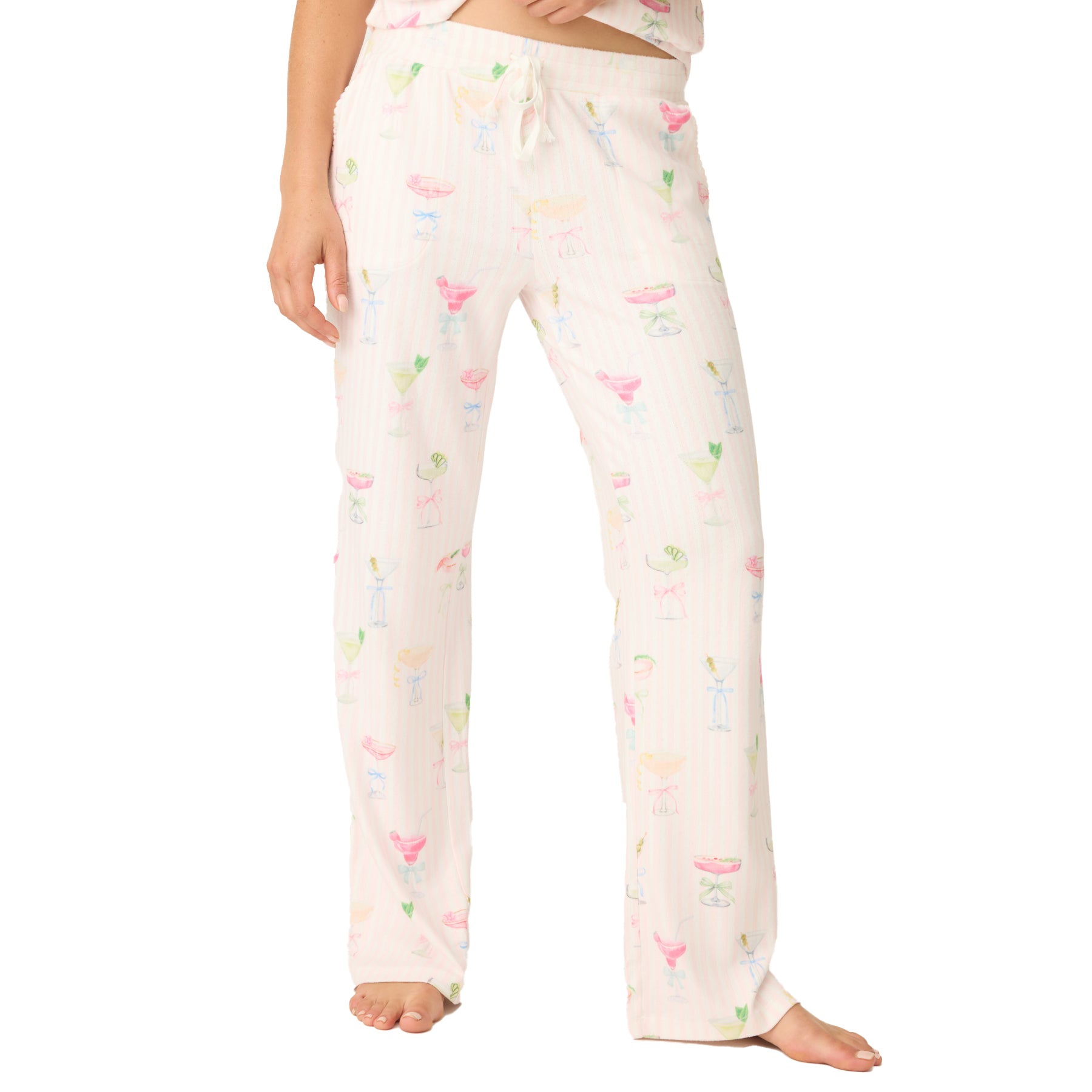 Front view of women’s pyjama pants in light pink with colourful cocktail print and drawstring waist.