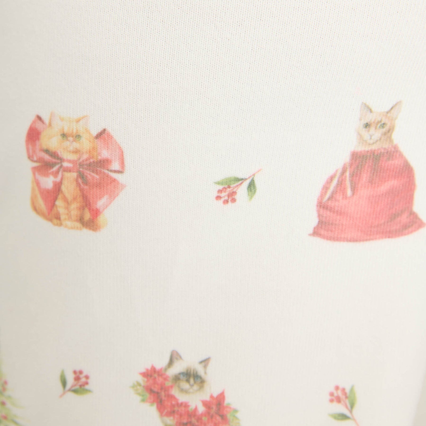 Pattern of cats in red dresses and bows on a white background