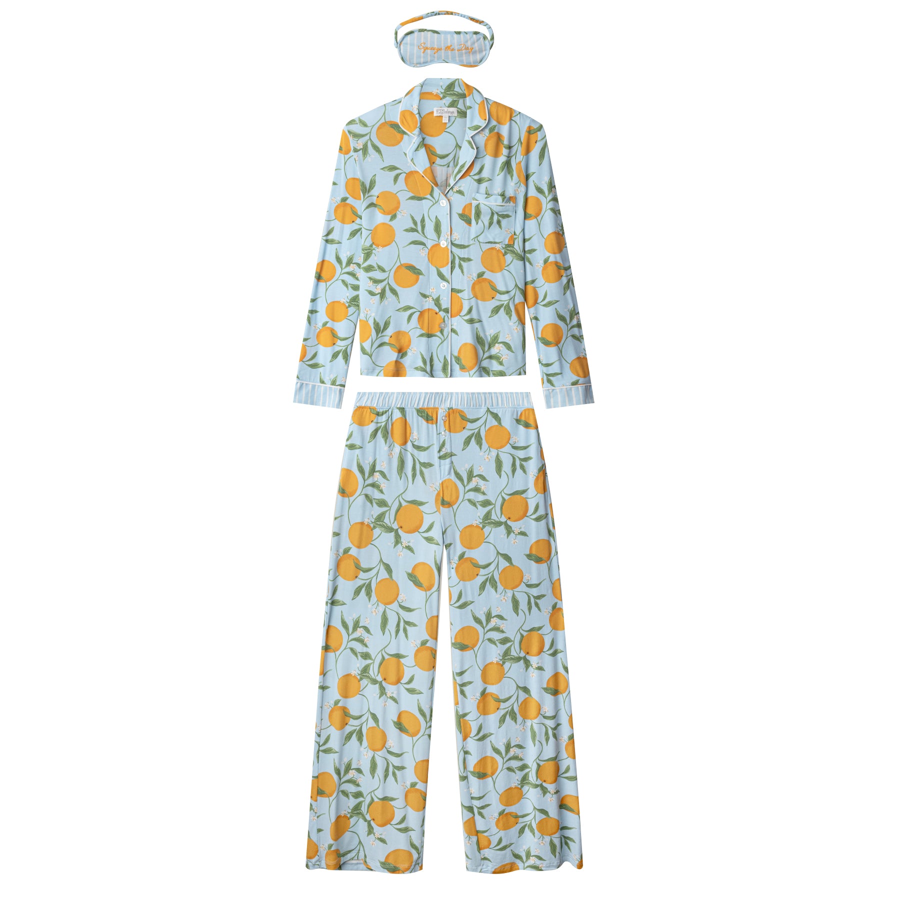 Light blue citrus print pyjama set with long sleeve button-down top, wide-leg pants, and matching sleep mask – flat lay on white background