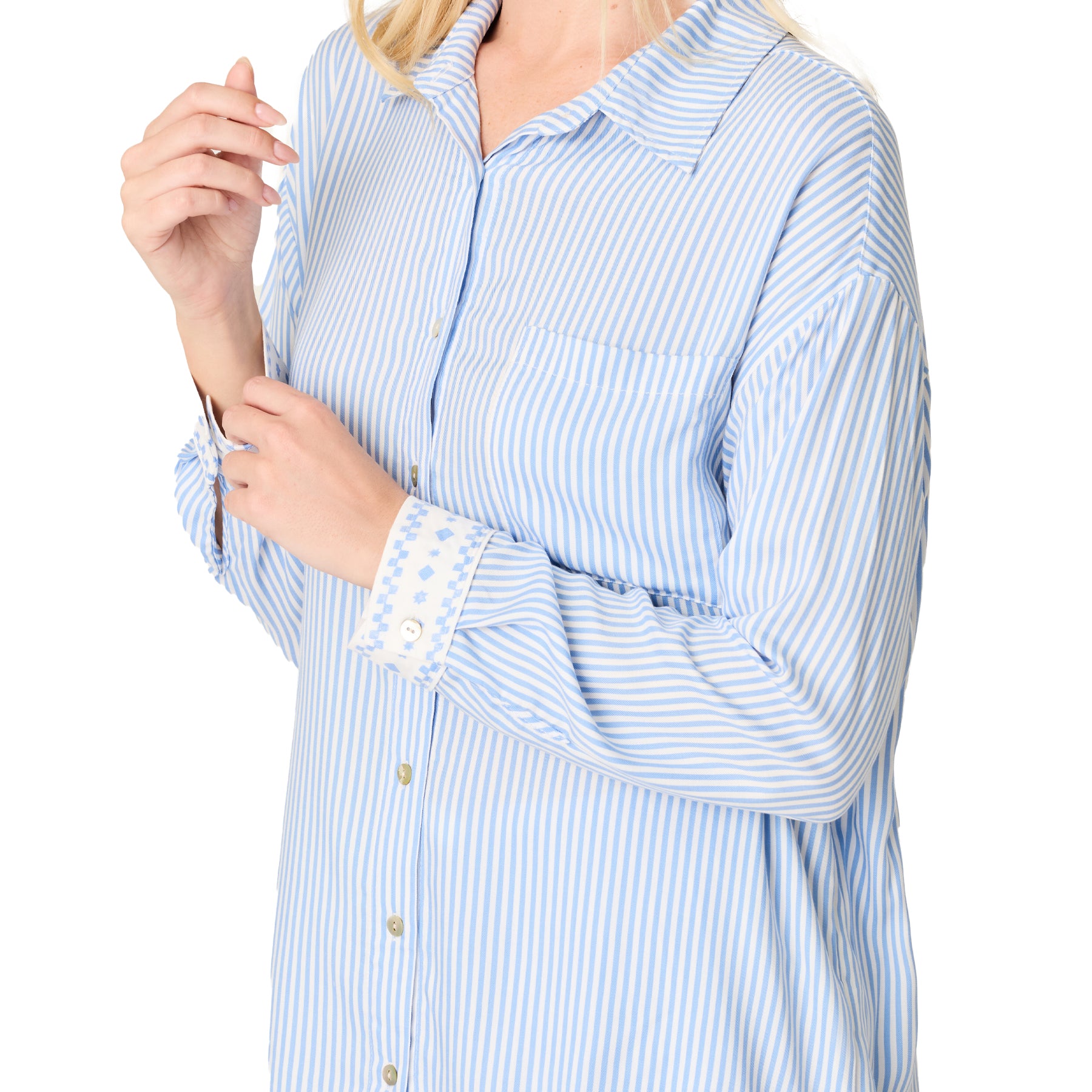 Close-up of blue and white striped pyjama shirt with collar and chest pocket detail