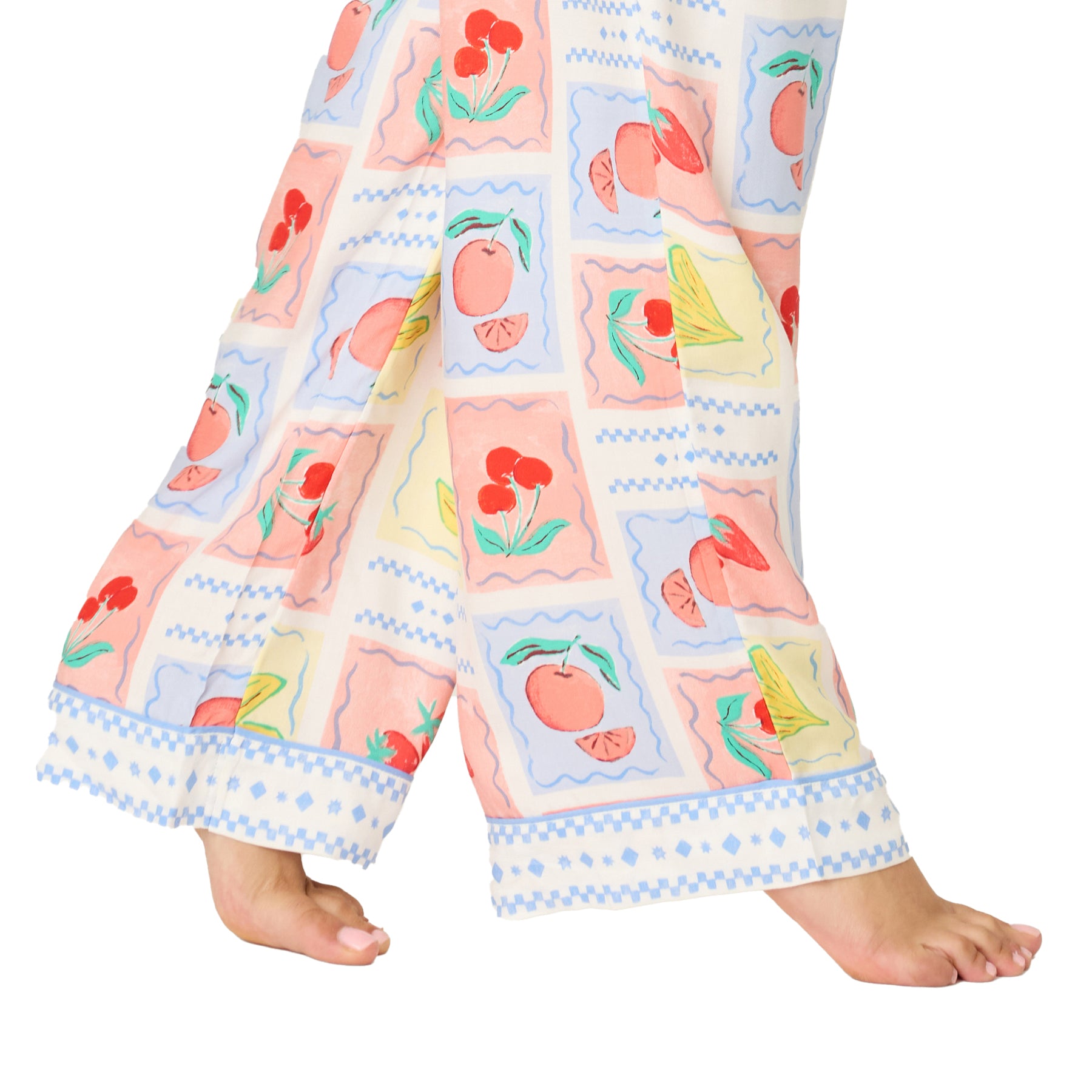 Close-up of pastel fruit print pyjama pants hem with decorative border detail