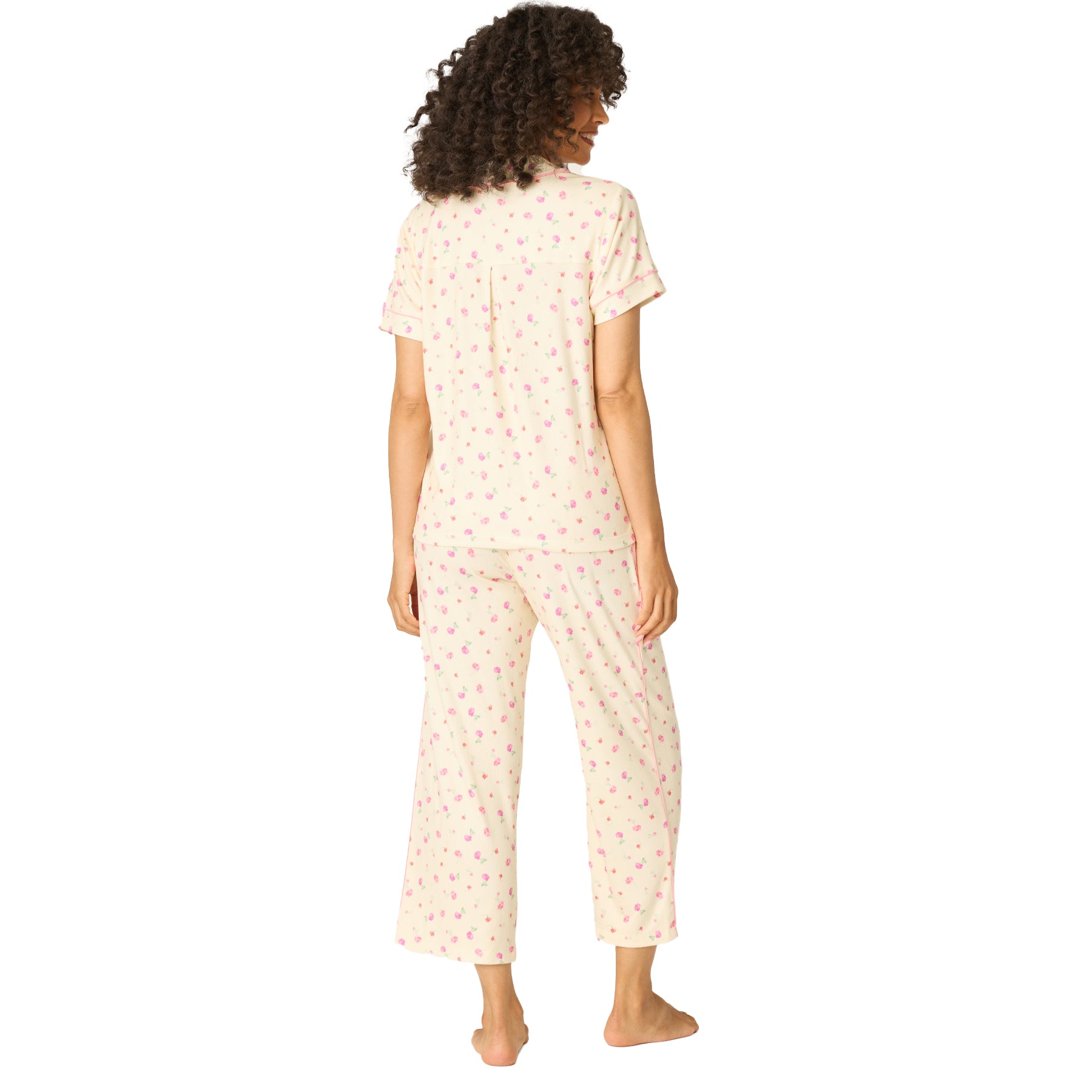Back view of women’s cream floral pyjama set with short sleeve button-down top and relaxed straight-leg pants