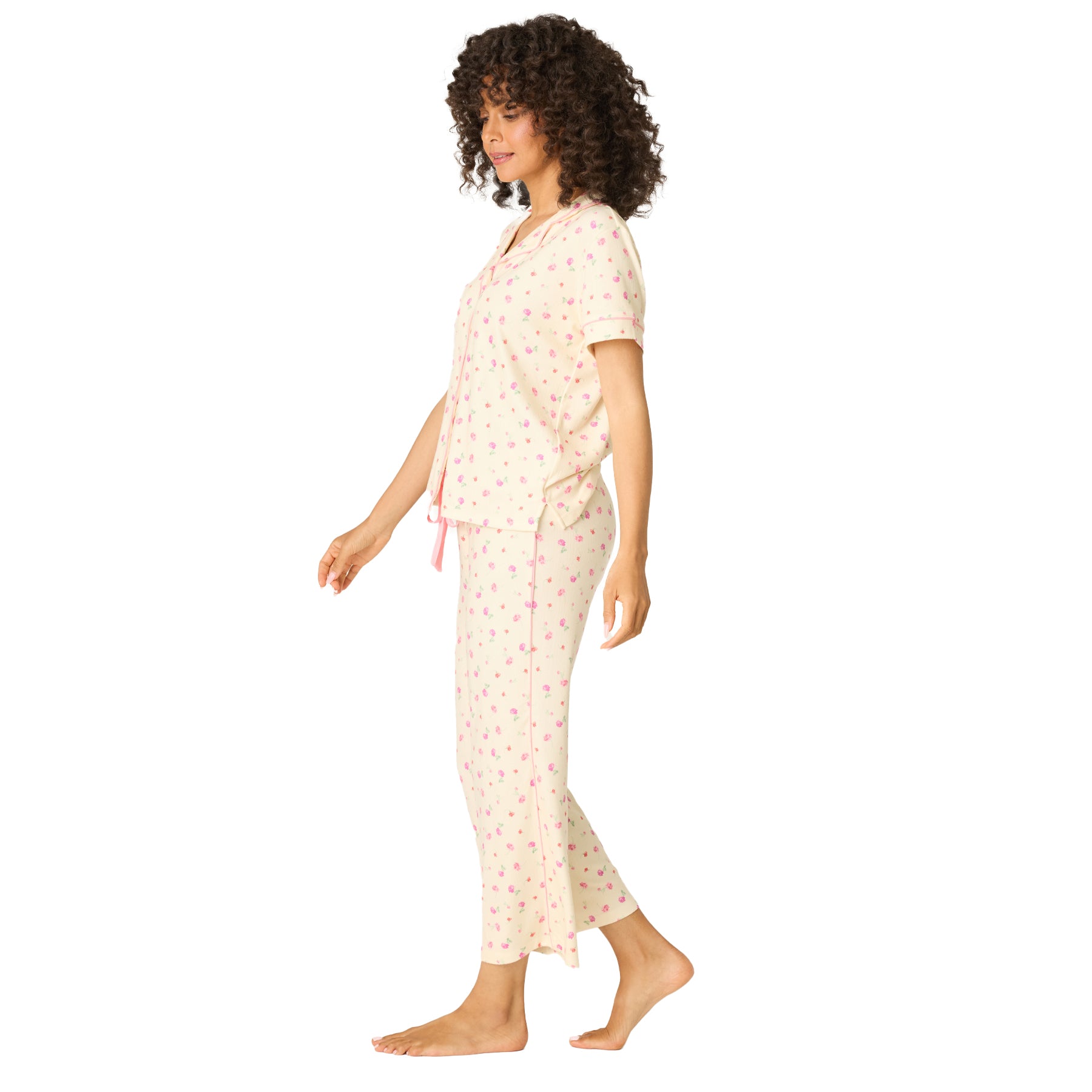 Side view of lightweight cream floral pyjama set with relaxed fit top and straight-leg pants