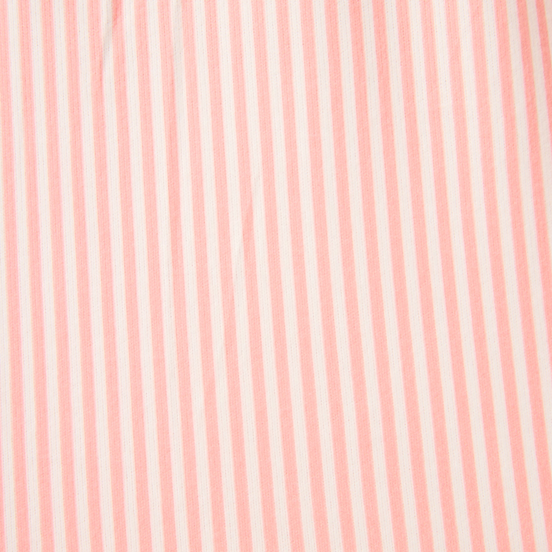 Close-up of pink and white striped fabric with soft texture and lightweight feel