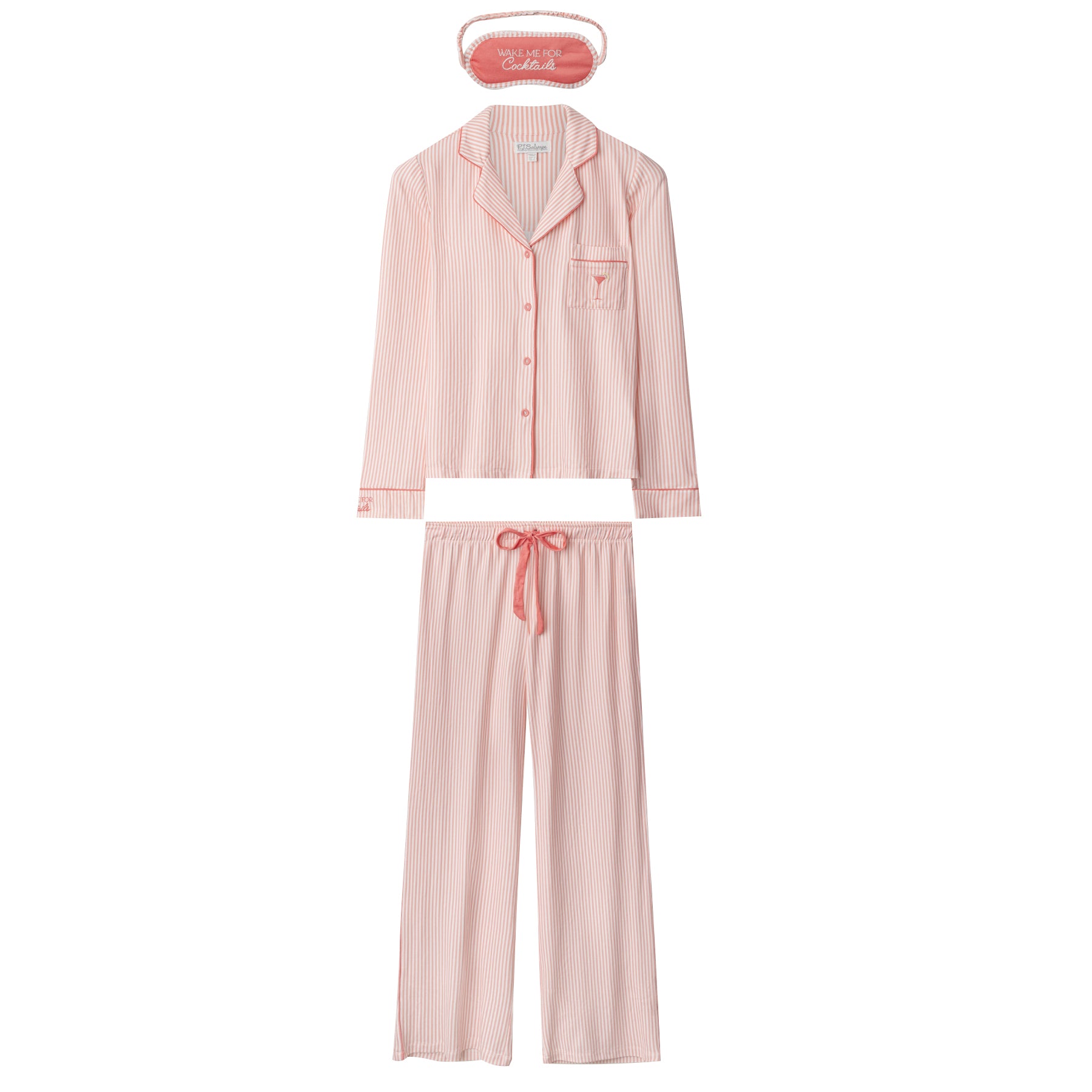 Flat lay of pink striped pyjama set with long sleeve top, drawstring pants, and matching sleep mask