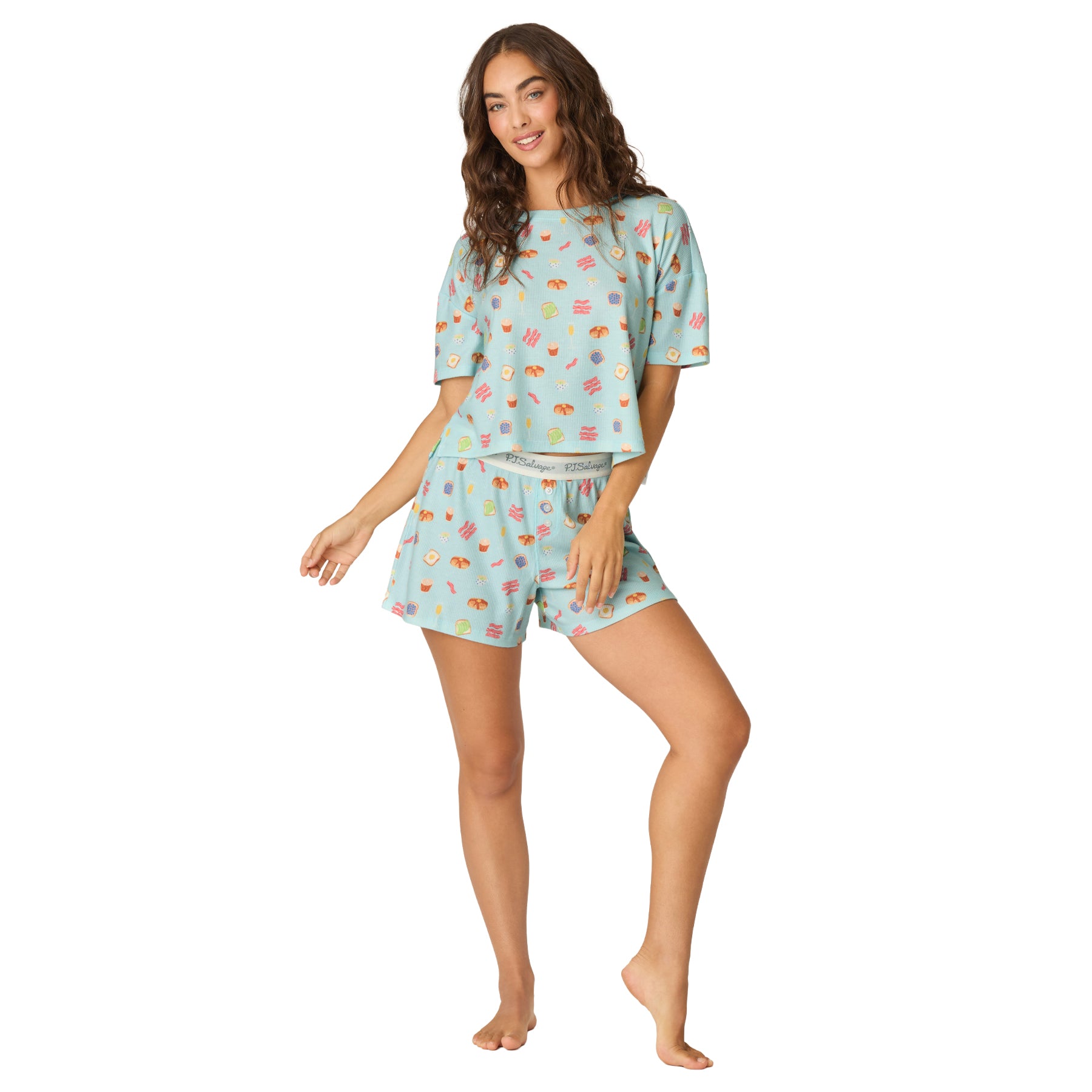 Women's light blue waffle knit pajama set with breakfast print, featuring a relaxed short sleeve crop top and matching pull-on shorts.