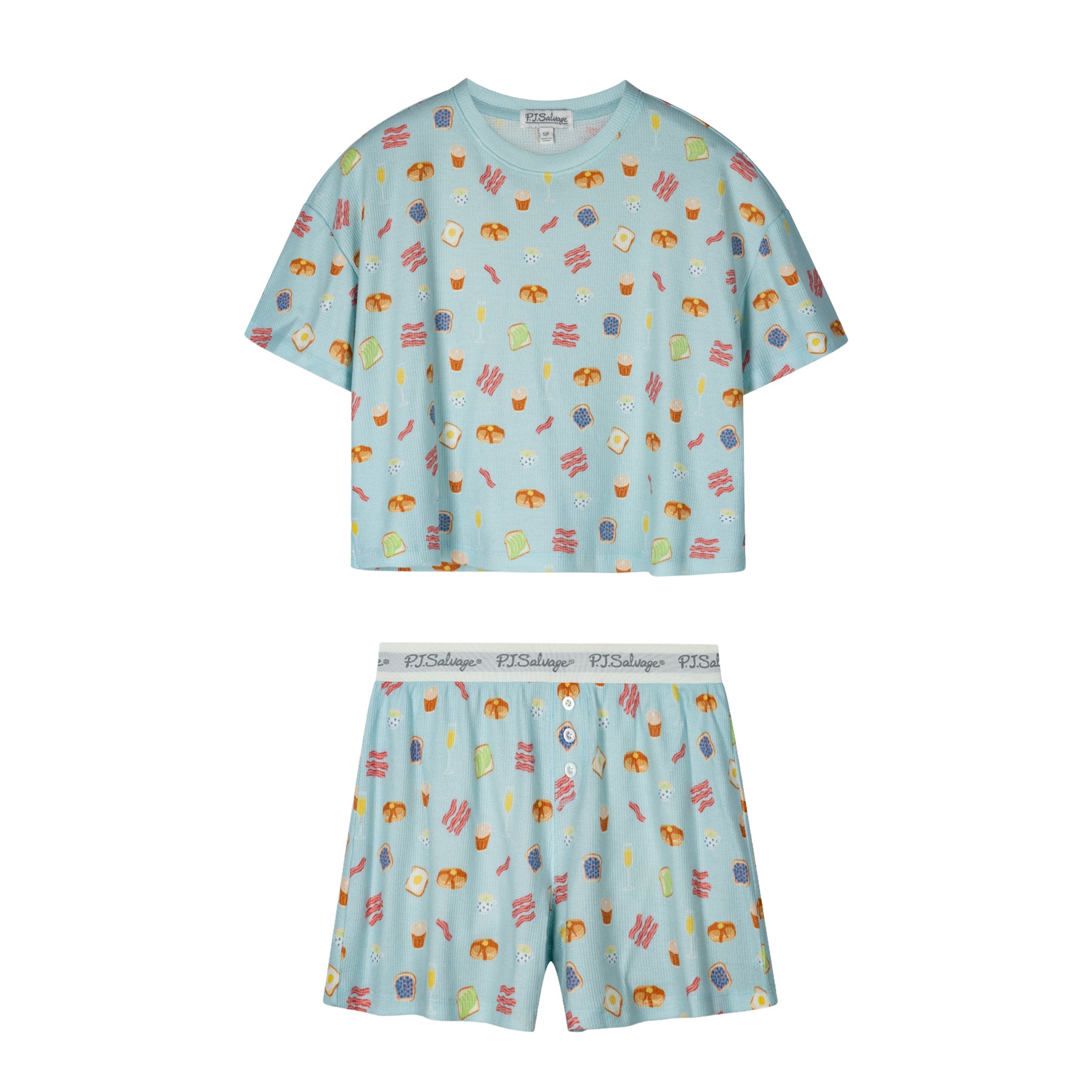Women's two-piece waffle knit pajama set in light blue with breakfast-themed print, including a short sleeve top and matching shorts.
