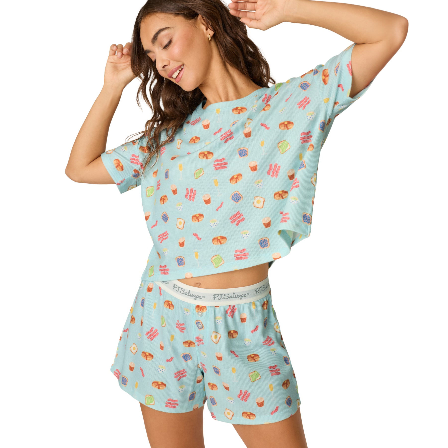 Women's relaxed fit waffle knit pajama set in light blue with whimsical breakfast print and soft elastic waistband shorts.