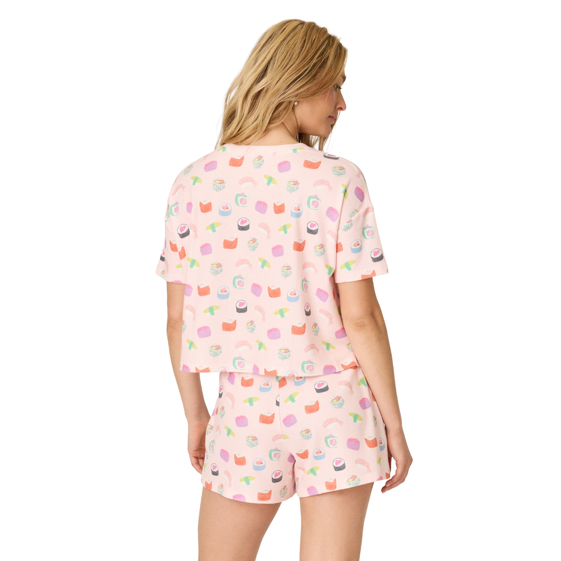 Back view of women's light pink waffle knit pajama set with colorful sushi print, featuring a relaxed short sleeve top and matching sleep shorts.