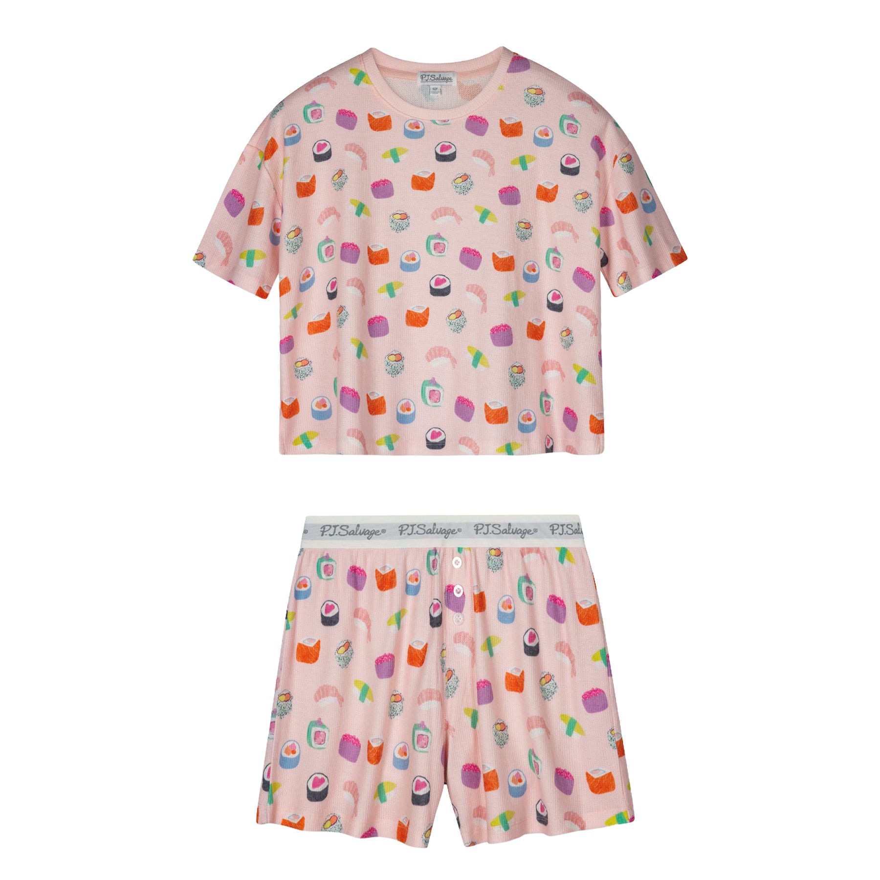 Women's two-piece waffle knit pajama set in light pink with sushi-inspired print, featuring a short sleeve top and matching shorts.
