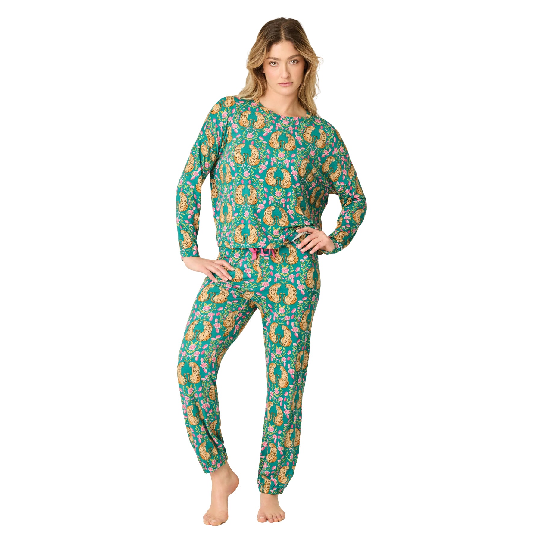 Model wearing a teal long-sleeve pajama set with cheetah and pink floral print, finished with pink drawstring detail.