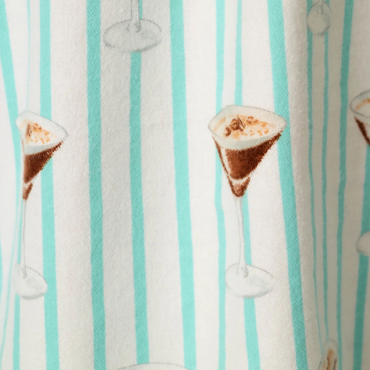 Close-up of espresso martini glass print on PJ Salvage Tipsy Time sleepshirt with mint and white vertical stripes.