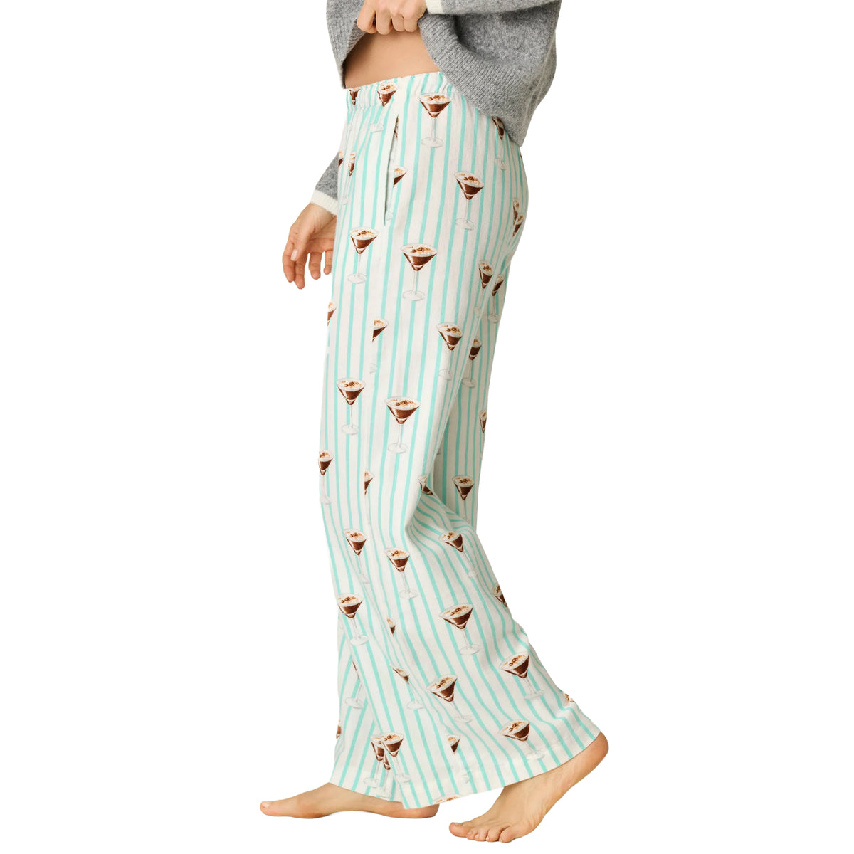 Model wearing PJ Salvage Tipsy Time striped pajama pants with relaxed wide-leg fit, side view.