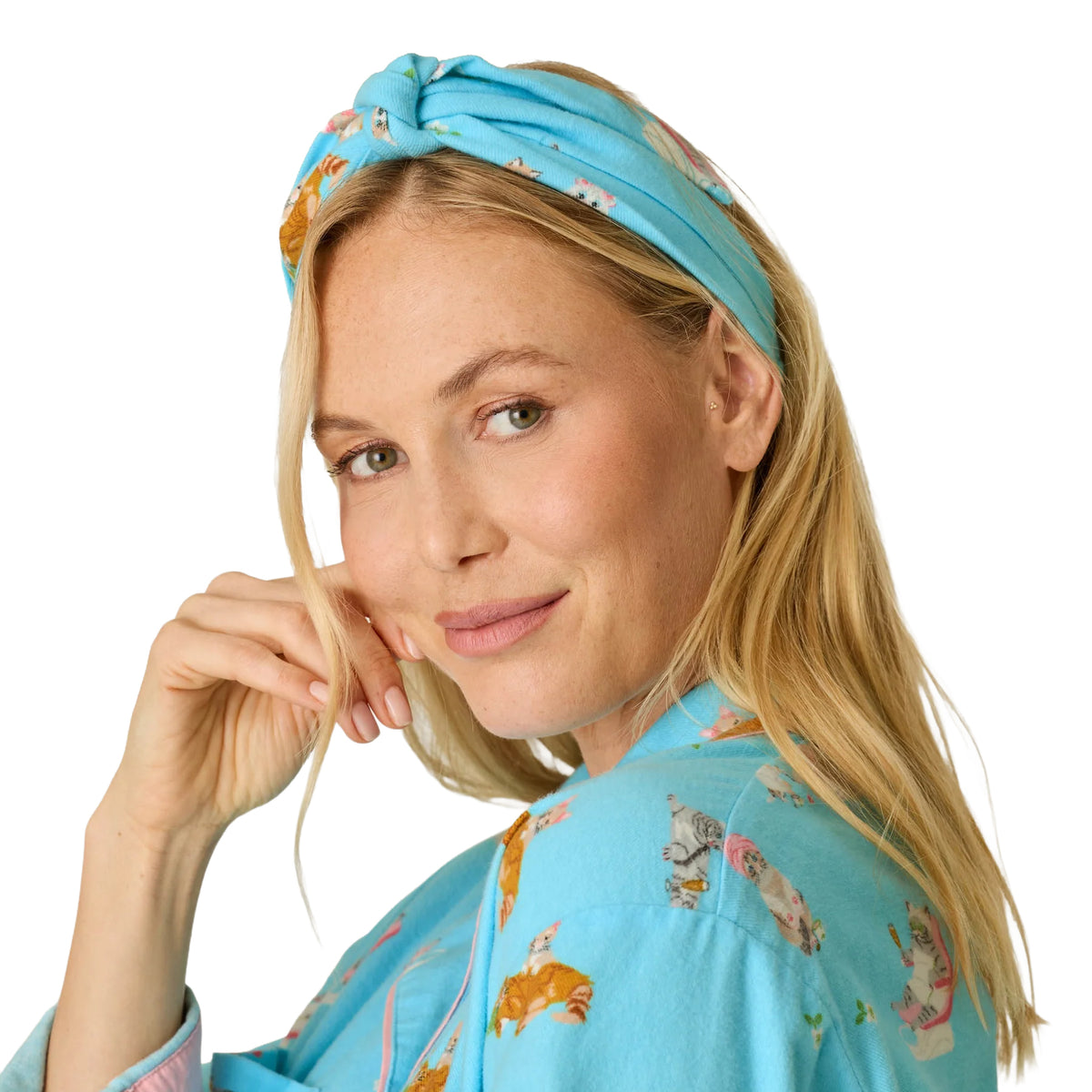 Close-up of model wearing matching blue cat print knotted headband from PJ Salvage Paws & Relax collection.