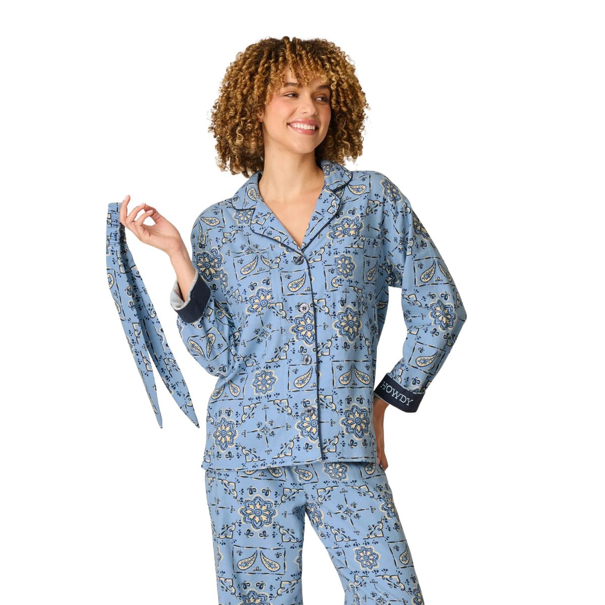 Model wearing PJ Salvage Howdy blue floral flannel pyjama set with navy cuffs and matching hair scarf, front view.