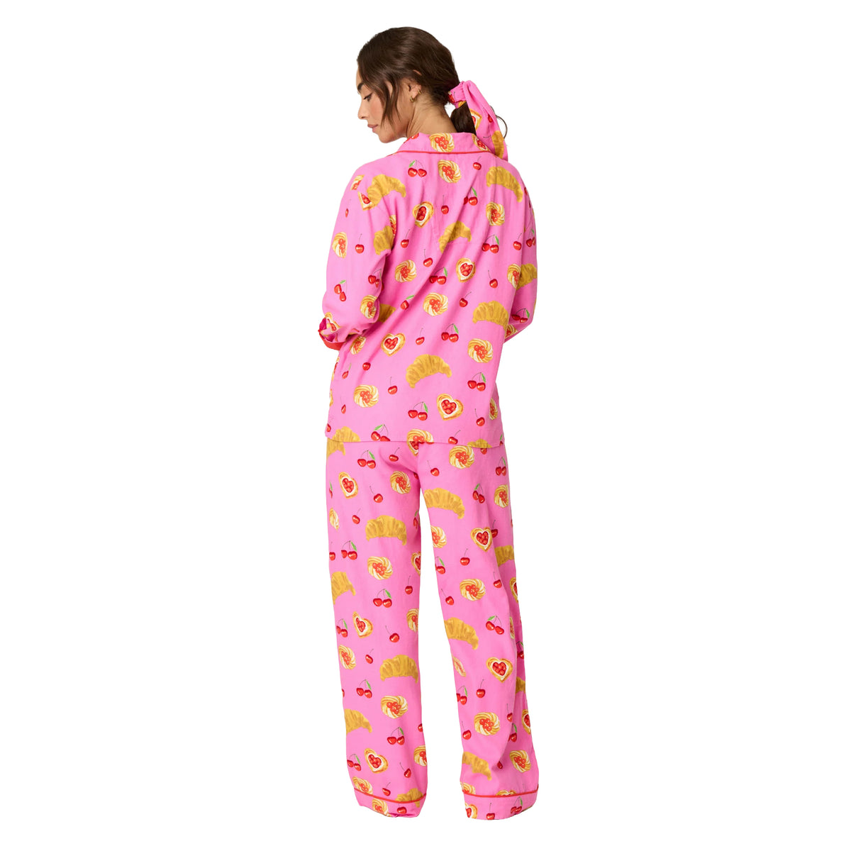 Back view of pink cherry and pastry print pajama set with matching printed hair tie.