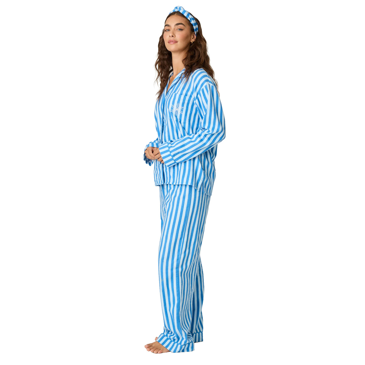 Model wearing blue and white striped flannel pajama set with matching headband, side view.