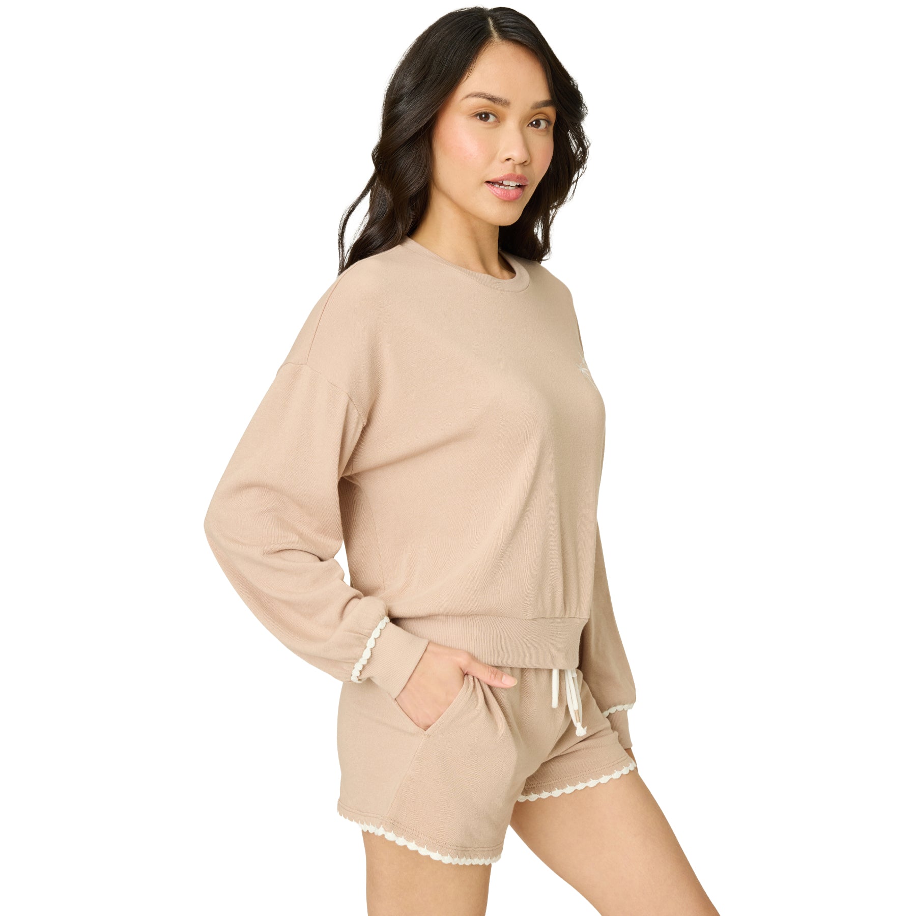 Side view of a women's warm taupe knit lounge set with a relaxed fit sweatshirt, embroidered palm tree detail, and drawstring lounge shorts.