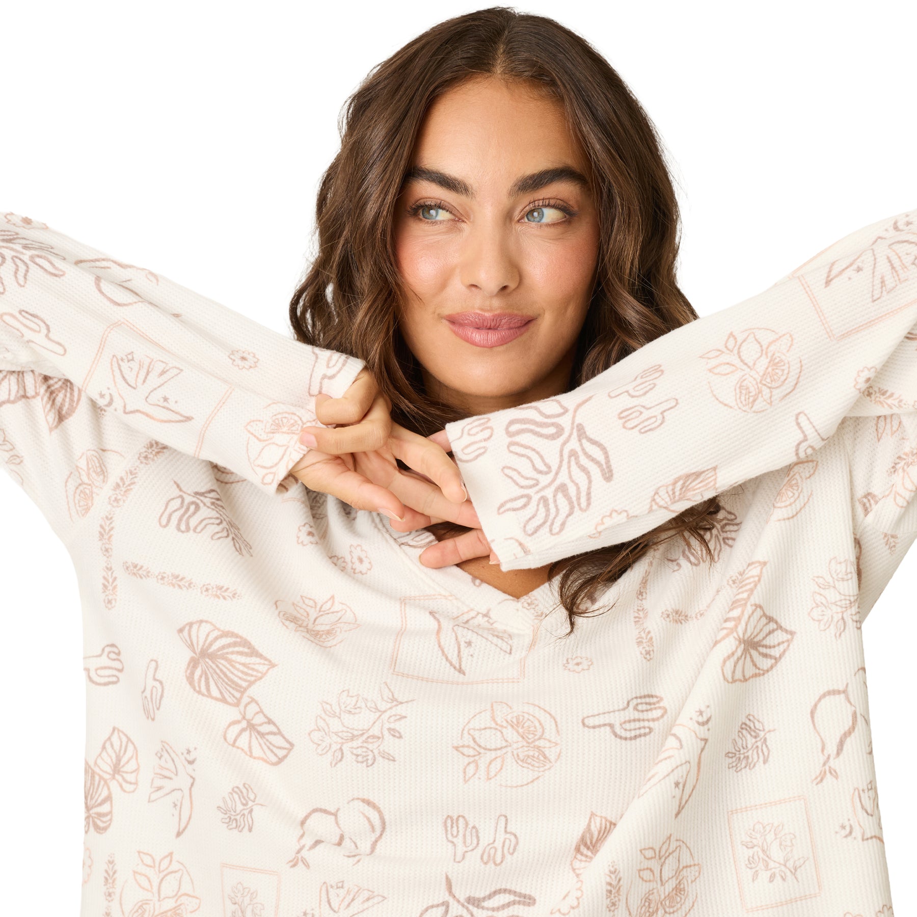 Close-up of a women's ivory waffle knit lounge top with an all-over tropical-inspired print in soft neutral tones.