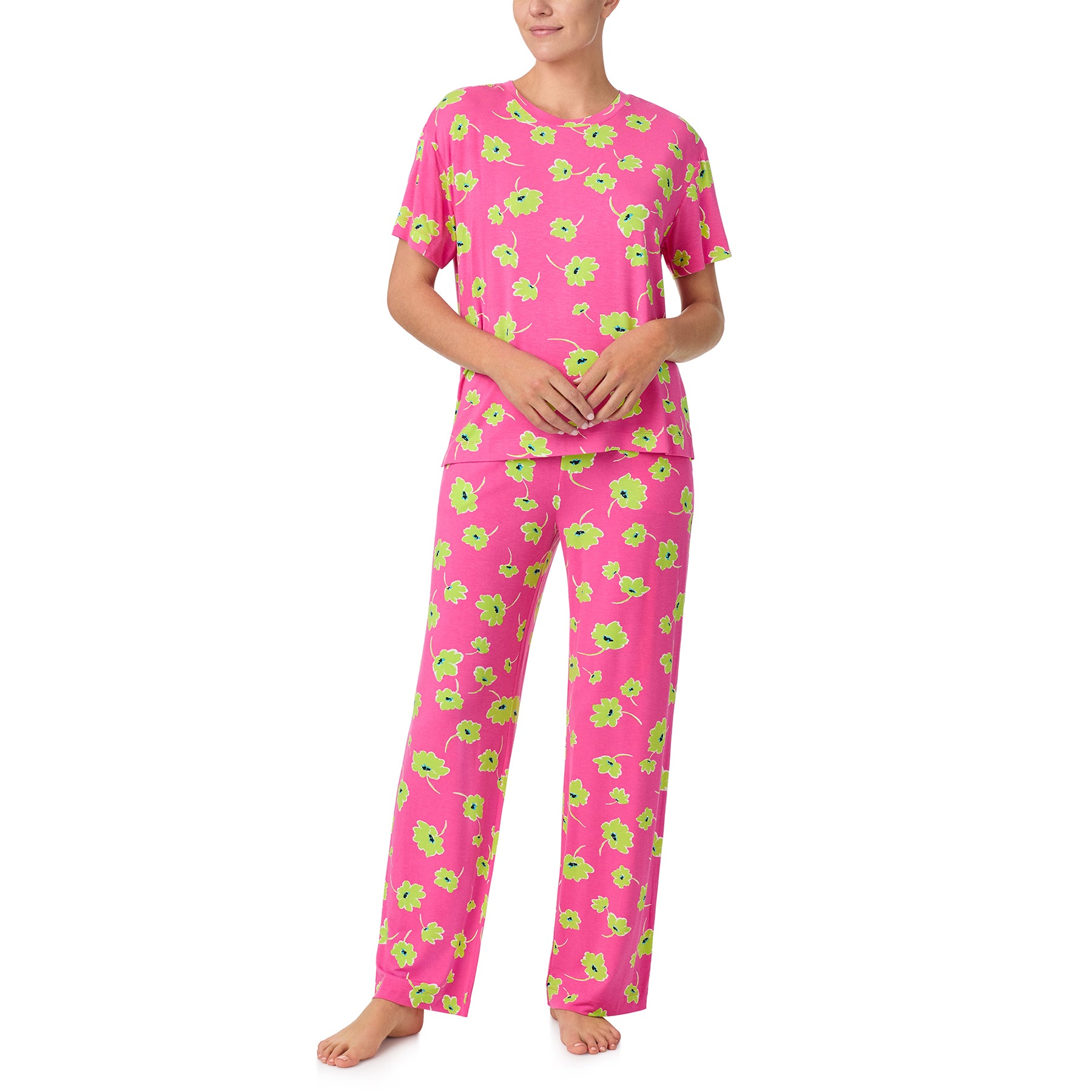 sanctuary short sleeve top and pants set in lime green poppy flower print on a hot pink background. Front view on model.