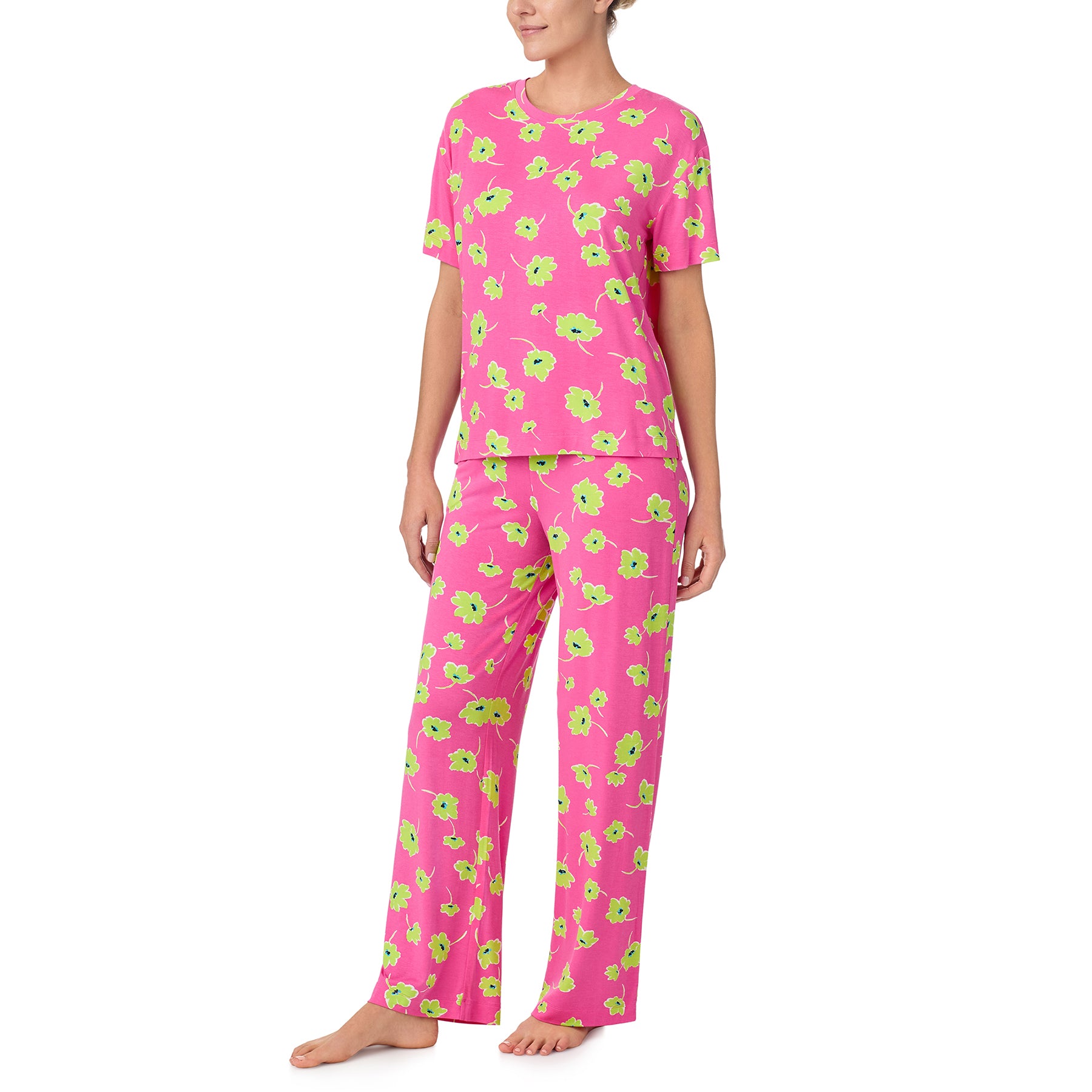 sanctuary short sleeve top and pants set in lime green poppy flower print on a hot pink background. Front view on model.