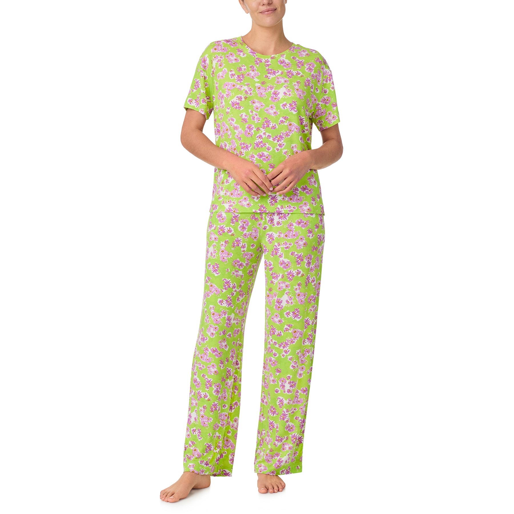 sanctuary short sleeve top and pants set in purple flower print on a lime green background. Front view on model.