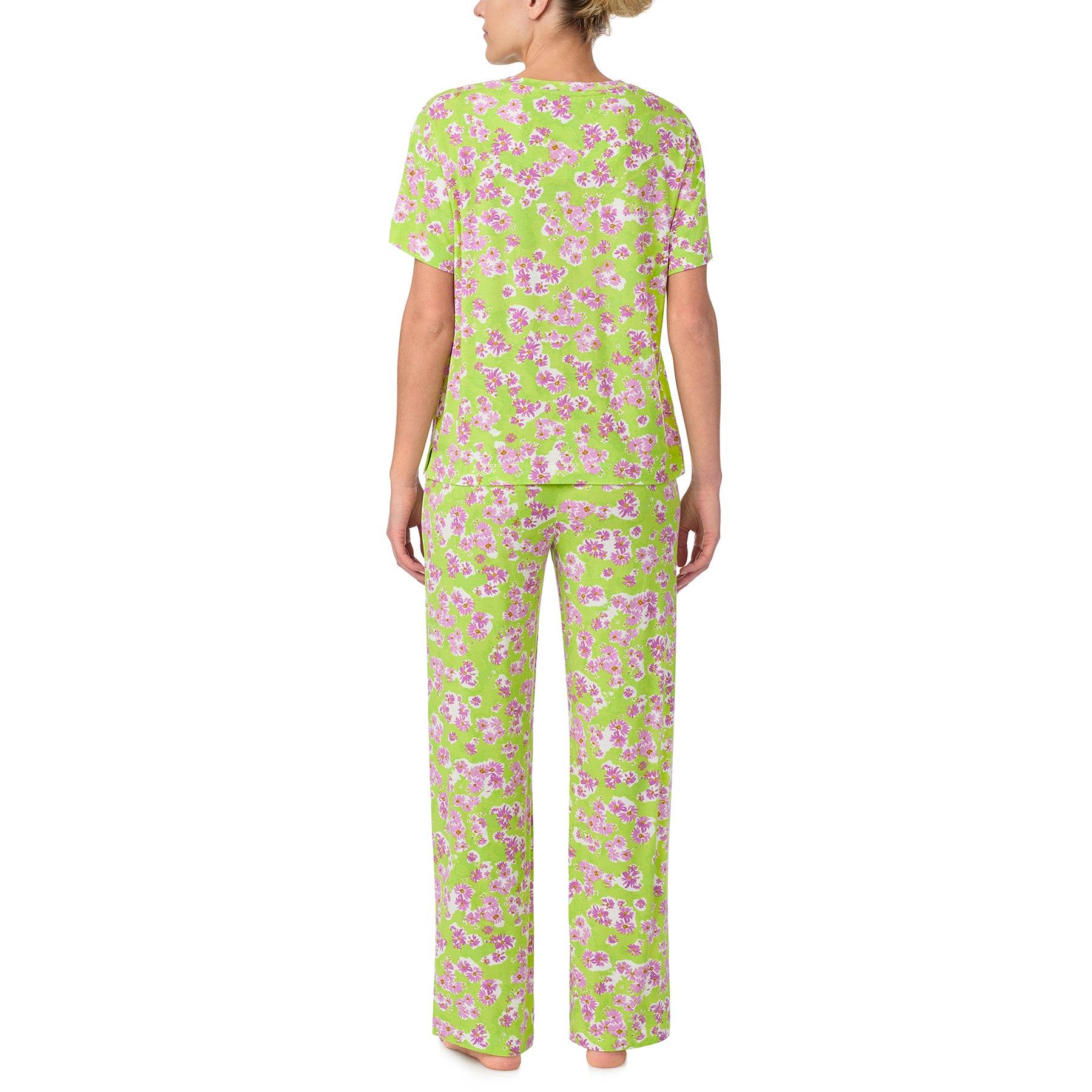 sanctuary short sleeve top and pants set in purple flower print on a lime green background. Rear view on model.