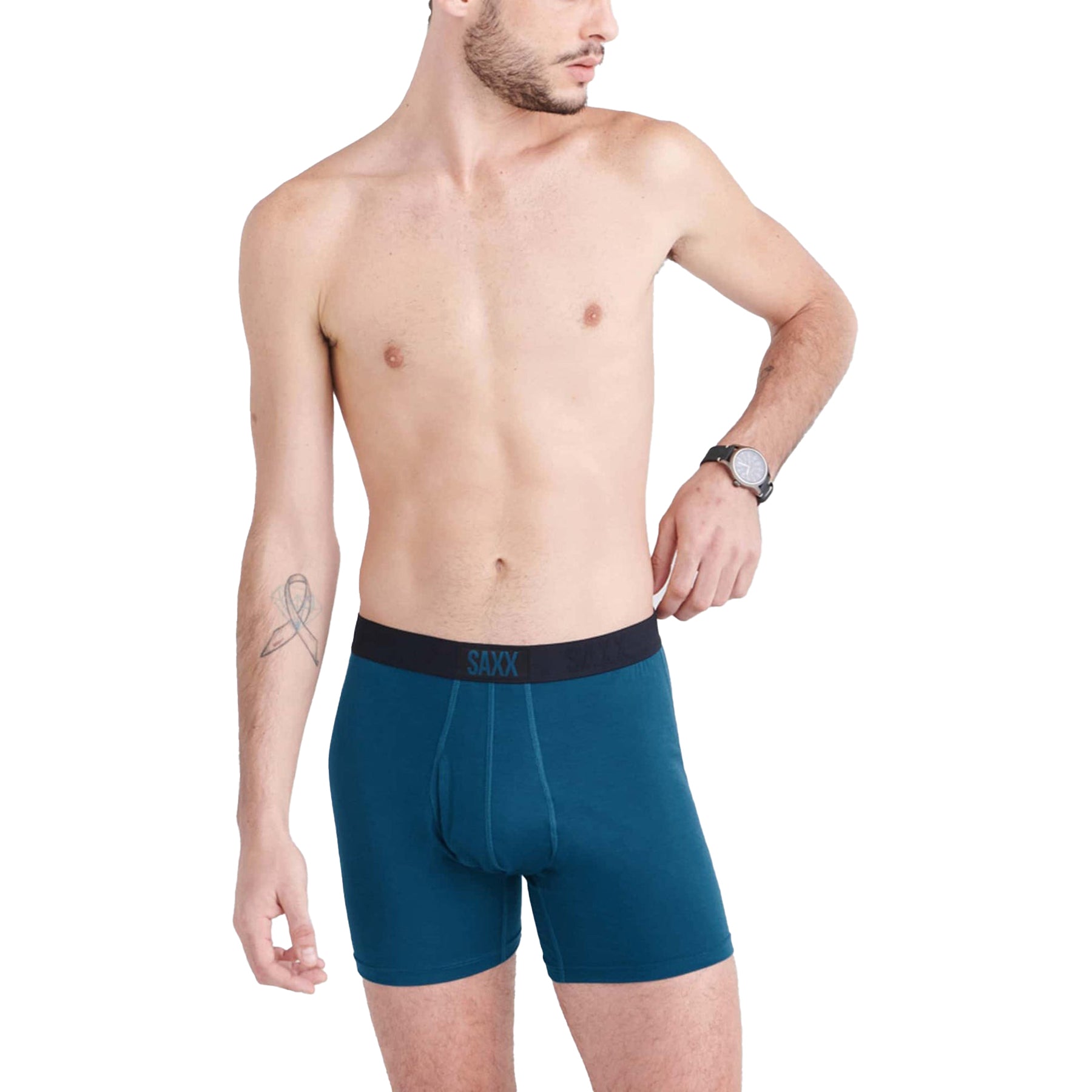 Front angle of SAXX Ultra Boxer Brief with Fly in solid Deep Ocean blue on model.