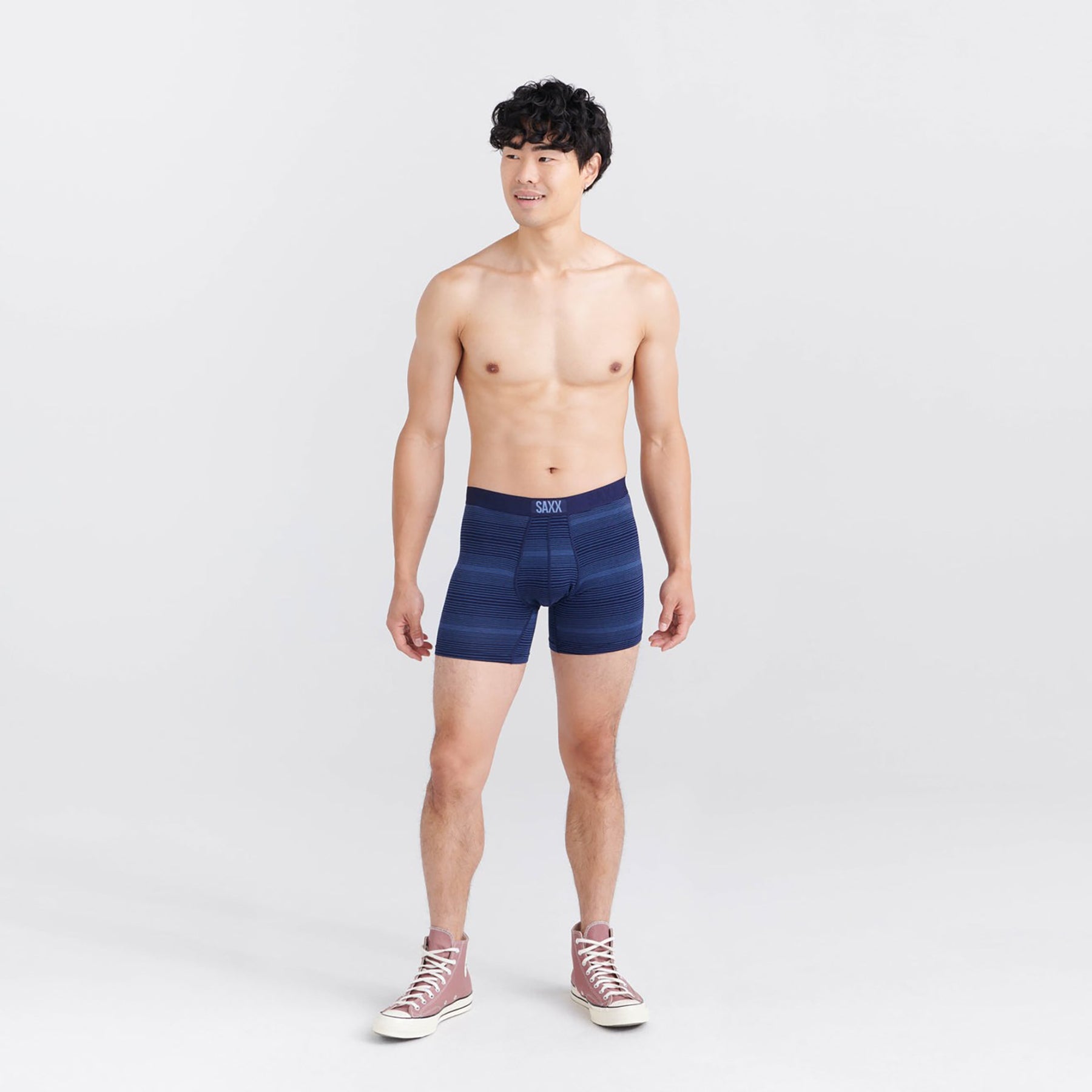 Front view of SAXX Vibe Boxer Brief in Variegated Stripe Maritime on model