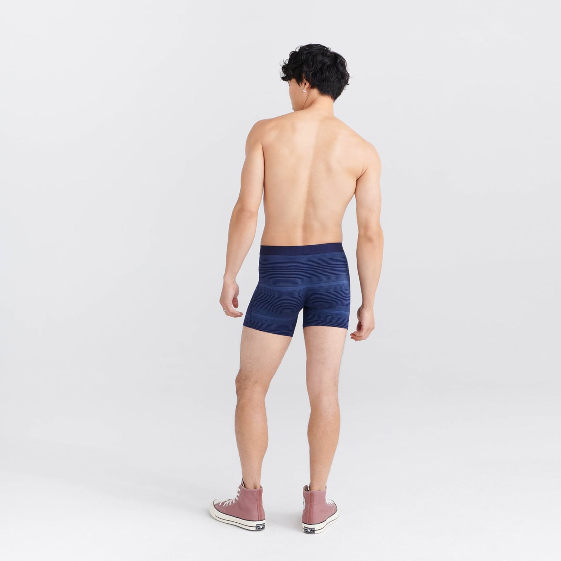 Back view of model in SAXX Vibe Boxer Brief in Variegated Stripe Maritime