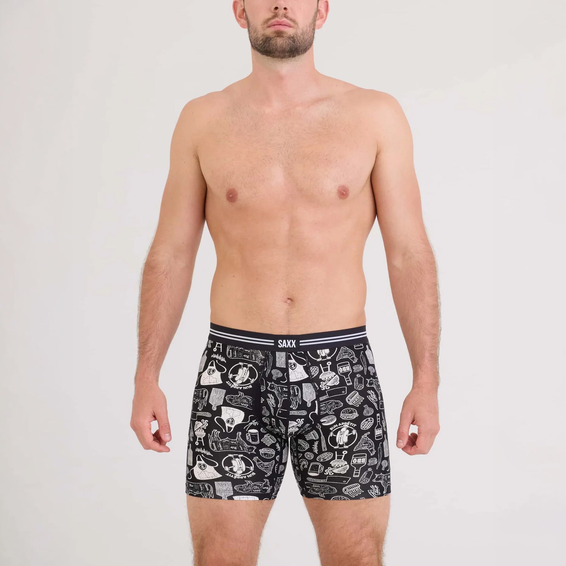 SAXX Vibe Xtra Soft Comfort Trunk #SXVX24F in bun appetit black BAB. Front view on model.