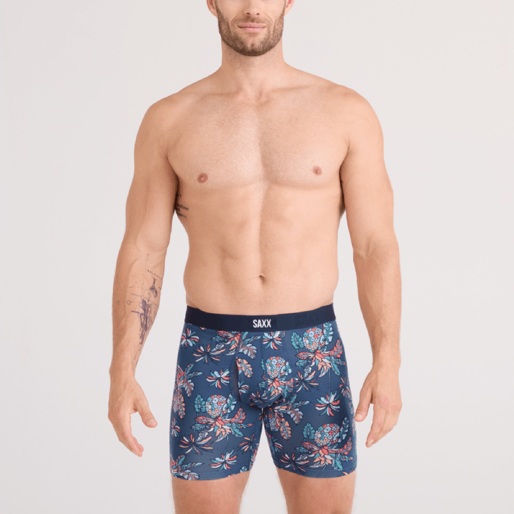 SAXX Vibe Xtra Soft Comfort Trunk #SXVX24F in pineapple tropic indigo PTI. Front view on model.