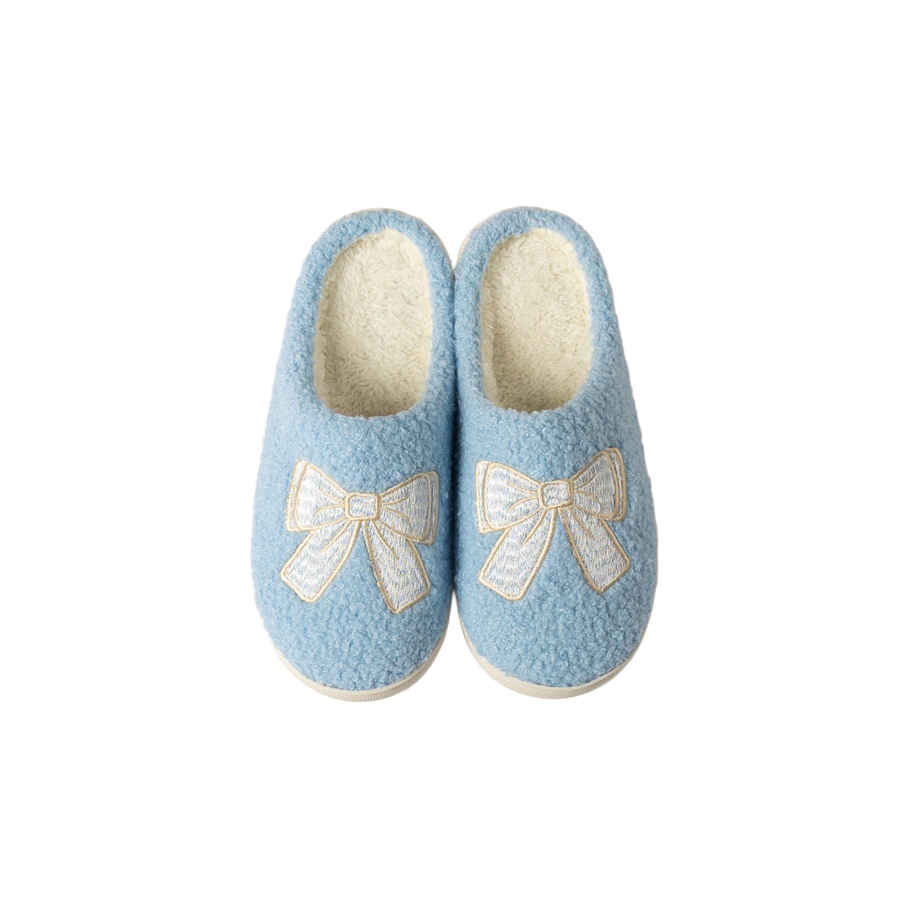 Top view of a pair of women's light blue fuzzy mule slippers featuring elegant ivory embroidered bows, cozy plush lining, and closed-toe design.