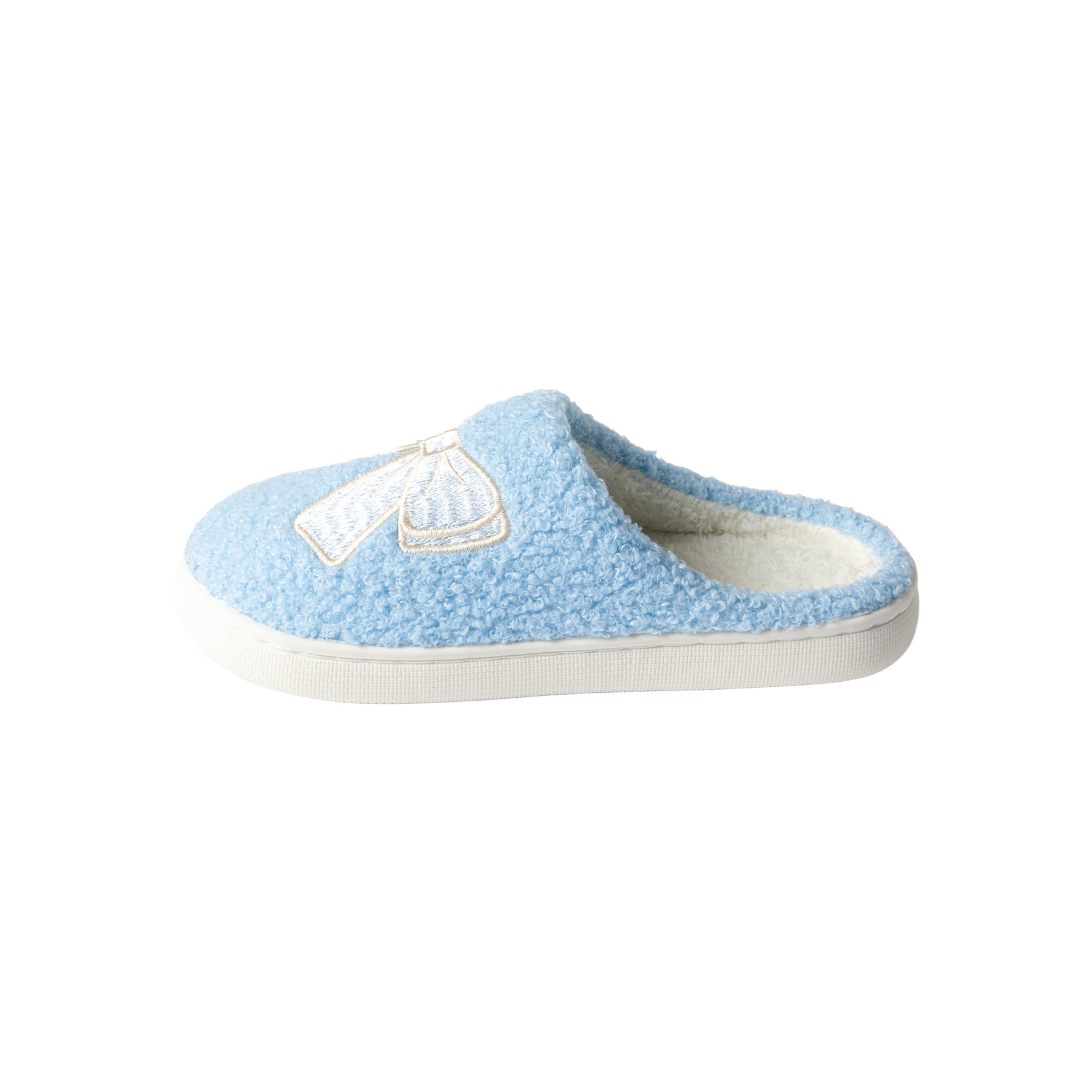 Side view of a women's light blue boucle mule slipper with an ivory embroidered bow, soft fleece interior, and durable white outsole.
